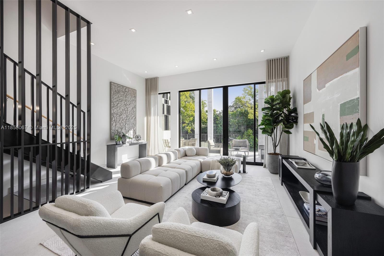 Award-winning contemporary residence in The Roads Townhomes featuring a distinctive formed-concrete façade. A dramatic open stairwell, volume ceilings and skylight define the airy interior. The sprawling second-floor living space with 12’ ceiling flows to a giant, glass-walled terrace. The chef’s kitchen offers Italian cabinetry, Wolf-Sub Zero appliances, porcelain slab surfaces and 10’-wide island for prep and counter dining. Spa-style master bath includes a freestanding tub, dual vanities and glass-walled shower. Additional highlights: multiple balconies, sound-insulated, private entry courtyard, Mondrian-inspired privacy screens, full-size 2-car garage and concrete construction with impact glass.