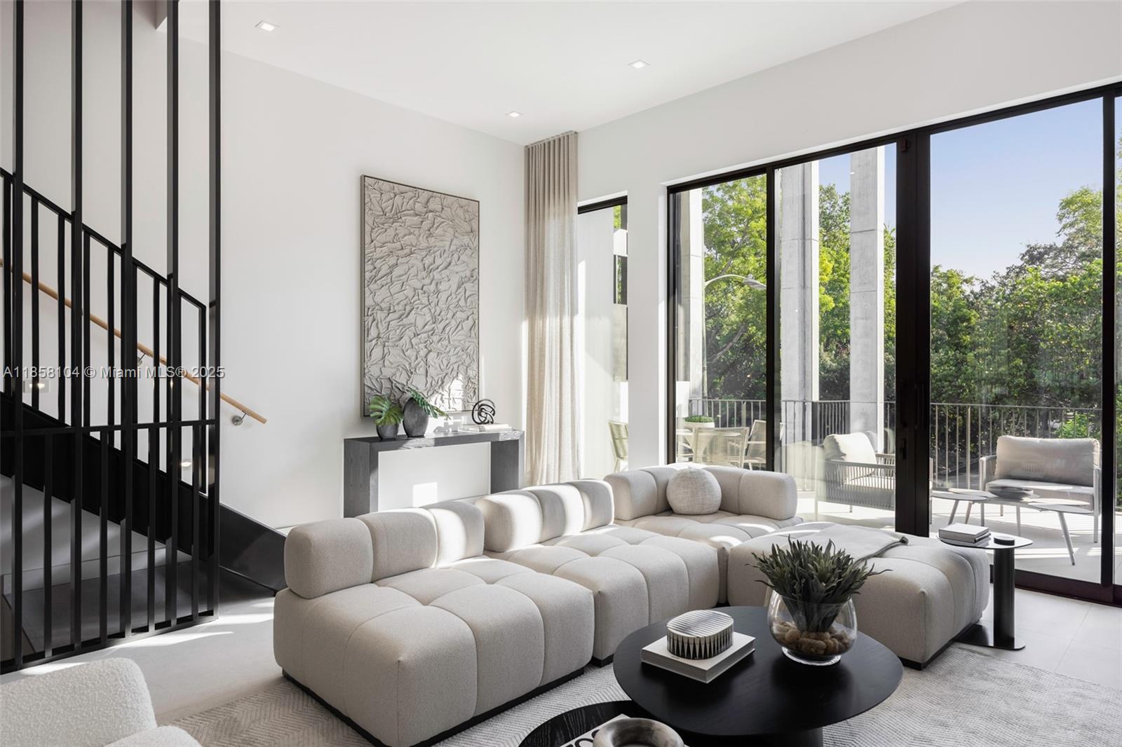 Award-winning contemporary residence in The Roads Townhomes featuring a distinctive formed-concrete façade. A dramatic open stairwell, volume ceilings and skylight define the airy interior. The sprawling second-floor living space with 12’ ceiling flows to a giant, glass-walled terrace. The chef’s kitchen offers Italian cabinetry, Wolf-Sub Zero appliances, porcelain slab surfaces and 10’-wide island for prep and counter dining. Spa-style master bath includes a freestanding tub, dual vanities and glass-walled shower. Additional highlights: multiple balconies, sound-insulated, private entry courtyard, Mondrian-inspired privacy screens, full-size 2-car garage and concrete construction with impact glass.