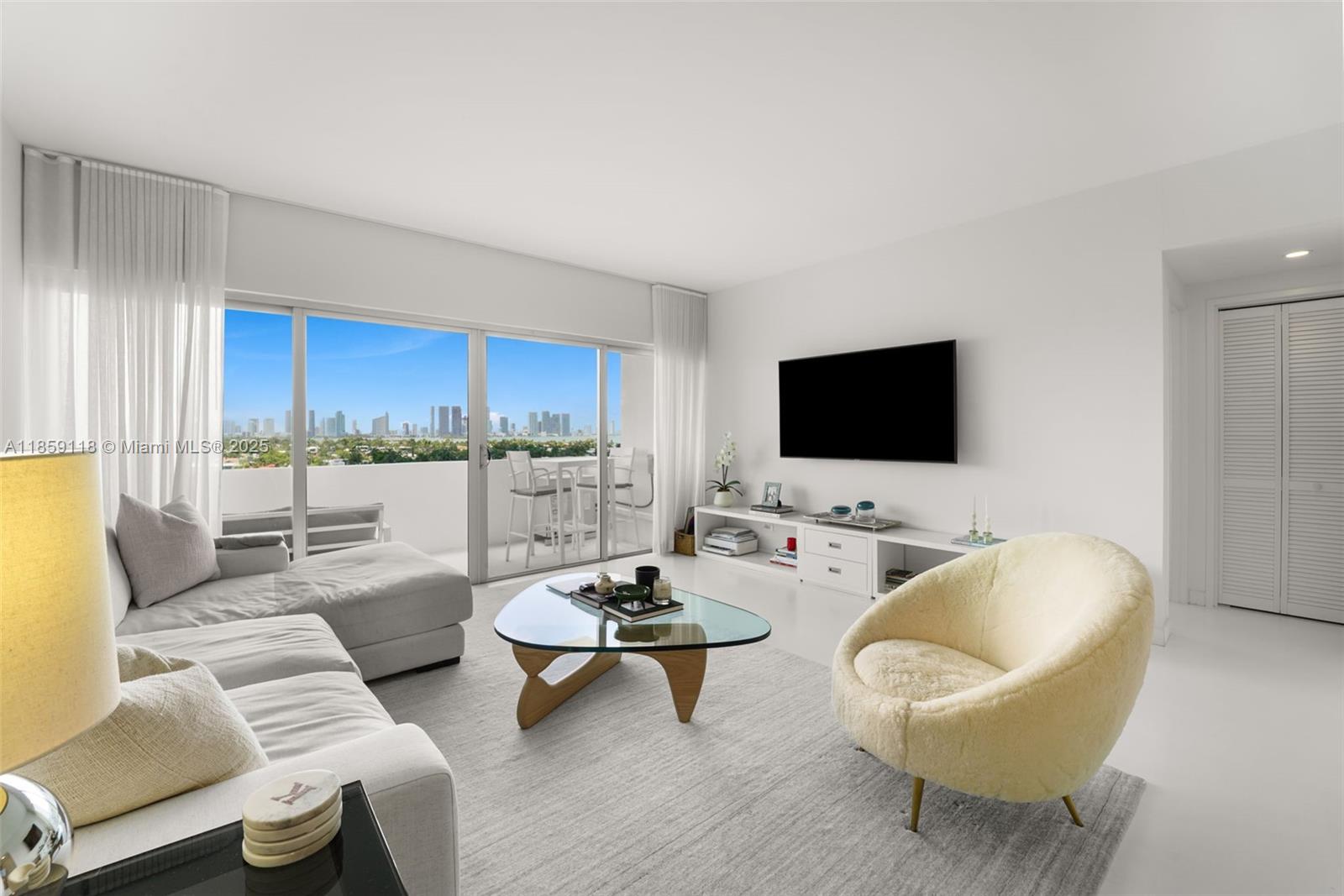 Presenting 3 Island Avenue 11G on Belle Isle. "Architectural Digest" quality renovation with no detail overlooked. This high floor unit offers Million Dollar views of Biscayne Bay and the Miami skyline & the most spectacular sunsets from every room. Sleek Italian custom kitchen with high end appliances. Brand new impact doors and windows  (complete wall of windows 4 panels not a partial 3 panel view).  Private Balcony with amazing views.   The building was designed by renowned architect Morris Lapidus. This mid-century gem is the perfect blend of luxury, style and timeless design.