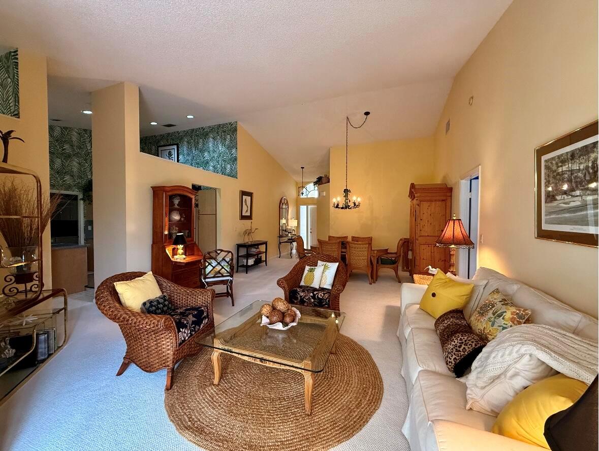 Welcome to 10148 Aspen Way, where style meets substance in one of Palm Beach Gardens' most desirable communities. This single-story stunner offers 3 bedrooms, 2 full bathrooms, soaring ceilings, and a serene garden view that instantly sets the tone. Sitting on a quiet street and zoned for Top-Rated Schools, the home features a Brand-New Roof and AC - a major win for today's savvy buyer. Inside, you'll find pristine, high-end carpeting (only a year old), a layout that flows, and endless potential.  Enjoy effortless living with resort-style amenities, and you're just minutes from premier shopping, dining, and world-class beaches. Opportunities like this don't come often. Make it yours!