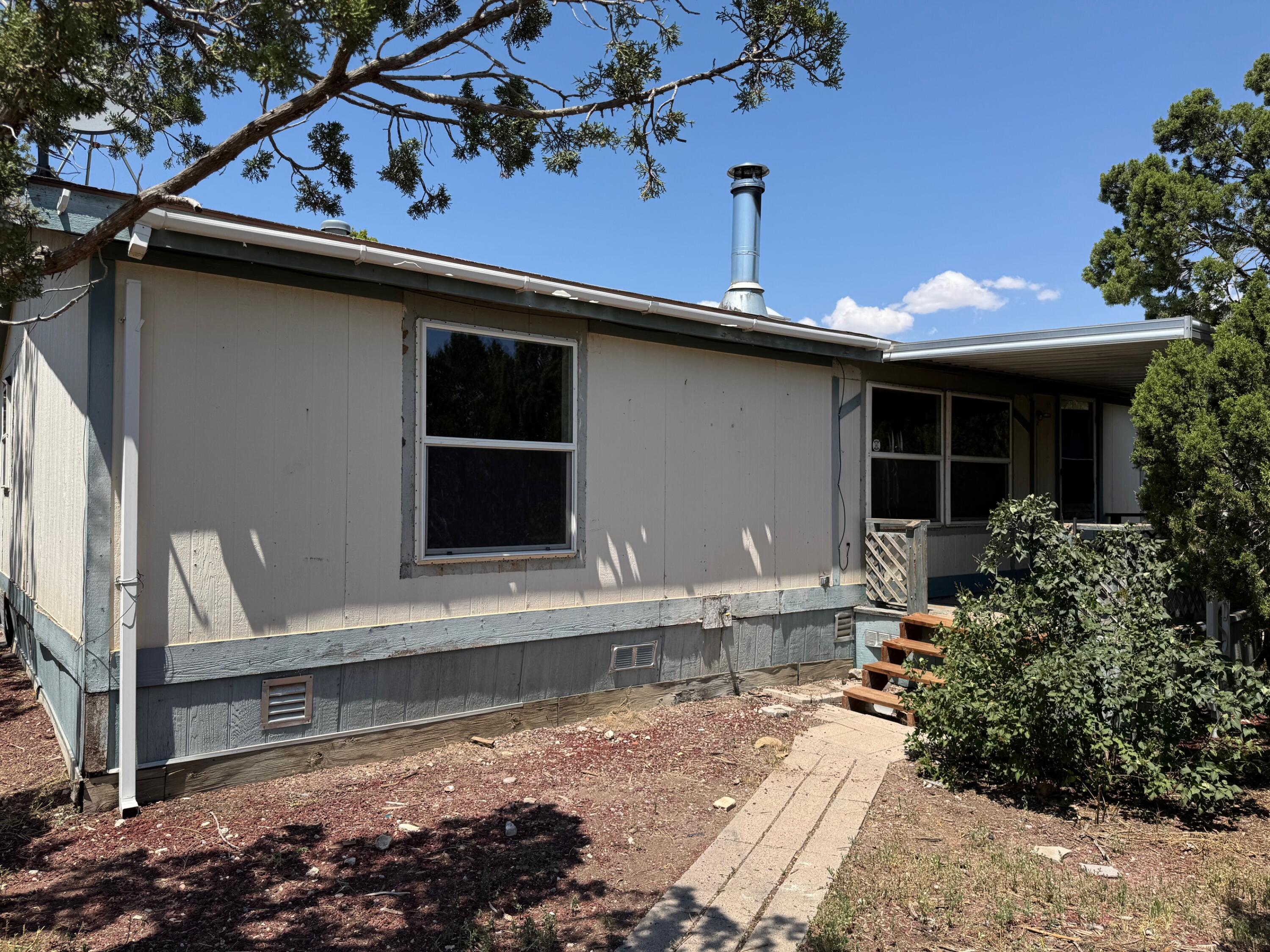 Prime Investor Special! Spacious 3-bedroom, 2-bath doublewide with an open floor plan, covered porch, and a huge workshop. Needs work, but the potential for equity growth is outstanding. Sold strictly as-is--seller will make no repairs--priced  to reflect condition.