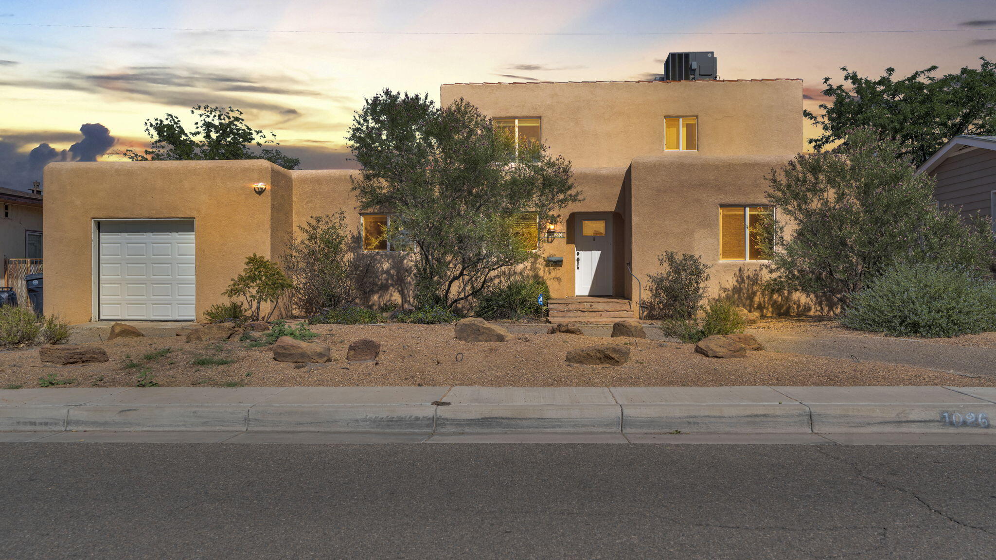 Exceptional opportunity near the University of New Mexico! This inviting two-story home offers 3 bedrooms plus a versatile bonus room--ideal as a 4th bedroom, private office, or inspiring art studio. Featuring 2 bathrooms, a cozy wood-burning fireplace, and beautiful hardwood floors, it blends timeless charm with everyday comfort. The spacious living areas are filled with natural light from large windows, creating a warm and welcoming atmosphere. Situated on a large lot, there's ample space for gardening, outdoor entertaining, or future expansion. Its prime location offers quick access to UNM, Nob Hill, shopping, dining, entertainment, and major thoroughfares. Whether you're seeking a family home, student housing, or a creative retreat, this property delivers unmatched convenience.