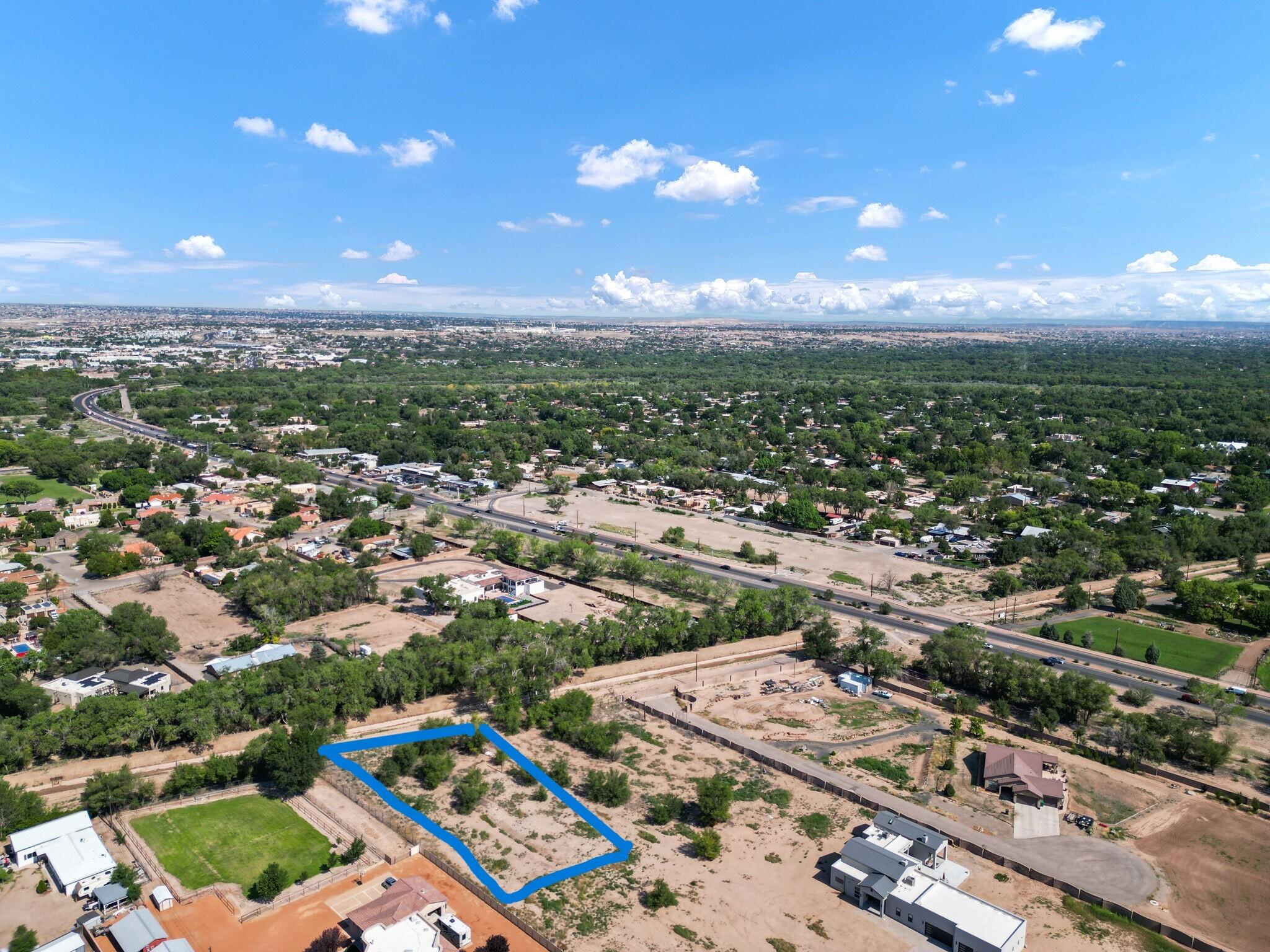Check out this prime location in the North Valley!  This level lot with views is a wonderful spot to build your dream home.  Seemingly private yet close to shops, restaurants and major roadways.  This property comes with MRGCD irrigation water rights allowing for beautiful landscaping to enhance your dream home!  Contact your favorite realtor and come see this property today!  Adjacent lot 1-A is also for sale.