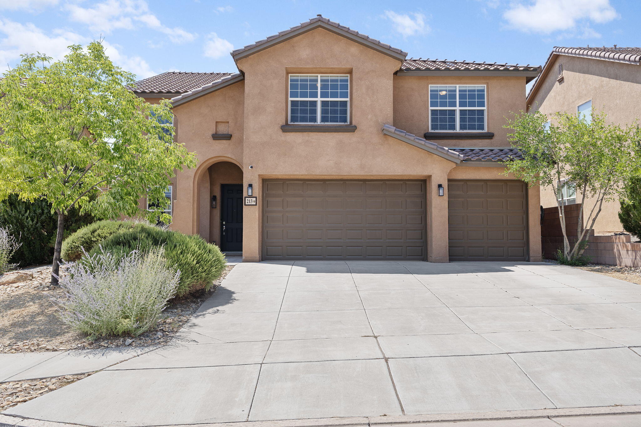 SELLERS OFFERING 5K CREDIT TOWARDS BUYER CLOSING COSTS. This home boasts pride of ownership inside and out. With 5 bedrooms upstairs and an additional room downstairs, this home has ample space. Centrally located to parks, shopping, schools and everything you could need. Some perks include; 3 car garage with EV charger, upgraded blinds, refrigerated air, tile roof, stainless appliances, new double oven, 2 living spaces, loft area and much more. Enjoy the oversized primary bedroom with huge walk in closet. The backyard is a private, manicured space, ideal for relaxation or hosting. This home has been well cared for over the years and is ready for new owners. Tucked away in a vibrant, well kept neighborhood, this property has everything you could need to call Rio Rancho your home!