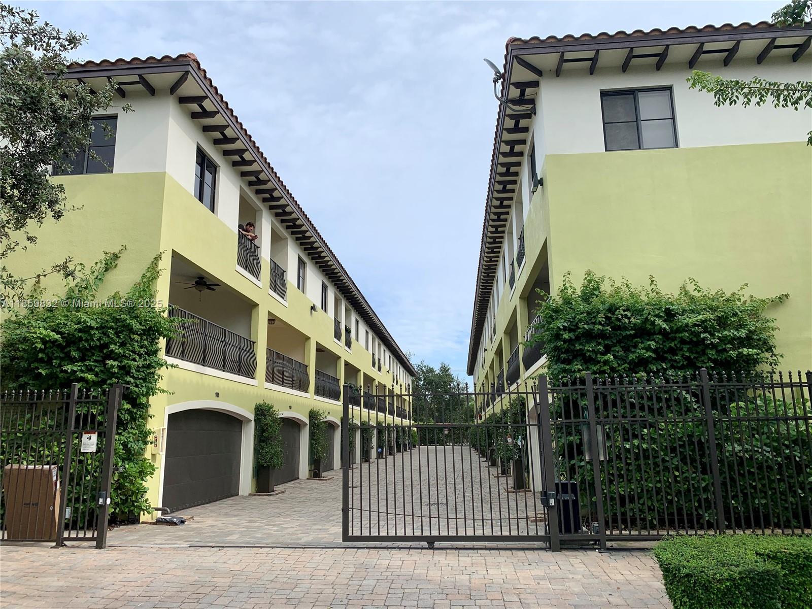 Beautiful tri level townhome 2 bed+den/2 full bath/2 half bath at the exclusive Grove Villas, a gated community in the heart of Coconut Grove. It features 2 bedrooms with enclosed baths on the 3rd floor with private balconies; a living/kitchen/dining area with 2 balconies and a half bath on the 2nd floor; a room on the 1st floor that can be used as an office, family room or guest room, a half bath, a 2-car garage, and large and private patio area. The property, including the garage has just been freshly painted. Amazing location: minutes to Coconut Grove's restaurants, farmer's market, entertainment and shops. It is very close from the Douglas Metro station, next to Miliam's Market and Home Depot Make this your home. The property is rented until October 5, 2026.