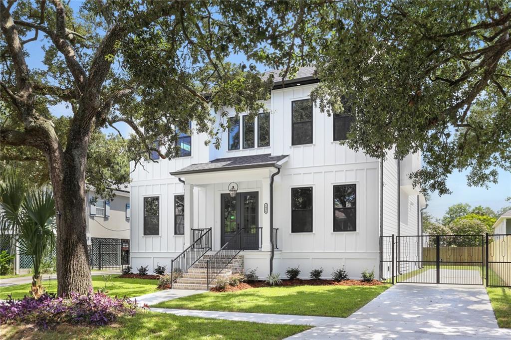 This exquisitely designed new construction is nothing short of A Perfect Presentation. Soaring ceilings, crown moldings and a grand staircase delight at first glance in the fabulous foyer. Rich 10-inch baseboards and dignified wood flooring dance throughout the entire home. Gorgeous built-in cabinets accent the modern electric fireplace/heater. The open floor plan design is all inclusive for the whole family including the chef who will fall in love with the gourmet, modern kitchen with quartzite counters and 2 tone cabinets.  2 bedrooms or an office and guest bedroom are on the lower level including 1 full en-suite bath and 1 half bath with beautiful custom tile work.  Upstairs, the massive primary en-suite bedroom has a walk-in closet to match making storage a dream.  Sachet by the custom barndoor to the ultra-luxurious quartzite and marble bath with separate free-standing tub and multi spray shower heads, custom modern tile work, a separate toilet closet, two tone cabinets and double sinks. 2 more huge bedrooms sharing a beautiful roomy bathroom with hexagonal porcelain tile work and a large laundry room with built-in cabinets, sink and granite counters are also on the upper floor.  Not to be missed is the ample landing providing for your personal design ideas.  Huge windows overlook the covered grand back patio, wired for sound. 2 gorgeous live oaks provide shade and that southern charm.  Clever, skilled craftmanship is evident in all aspects of this fine home! agent ownership interest.