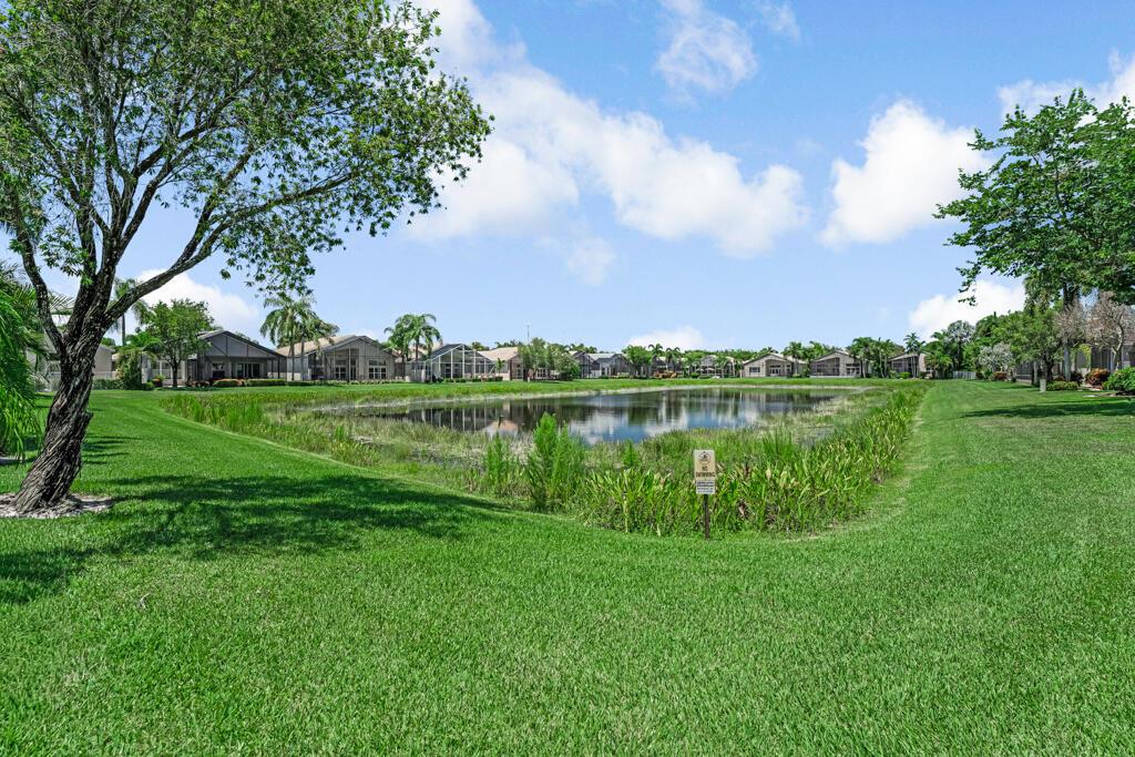 Beautiful Lake front much sought after home situated in the center of the most loved 55 plus super active community, known for its highly active sports and entertainment complex! This highly sought after floorpan boasts 3 beds, 2 1/2 baths & a peaceful, serene screened lanai overlooking the lake. No main roads, walk to both the social hall, & athletic center! 10 tennis, 6 pickleblall, 3 bocce crts, full time pro, 2 indoor racquetball crts too!  A beauty salon, state of the art fitness center, massages,sauna, steam, full time social director, clubs, organizations, so much to do! Tropical social pool, resistance and lap pool, indoor whirlpool, more! Lightly  lived in Mr and Mrs snowbird kept this home pristine! Furniture negotiable, make it your own and move right in!  Priced low! LOVE IT!