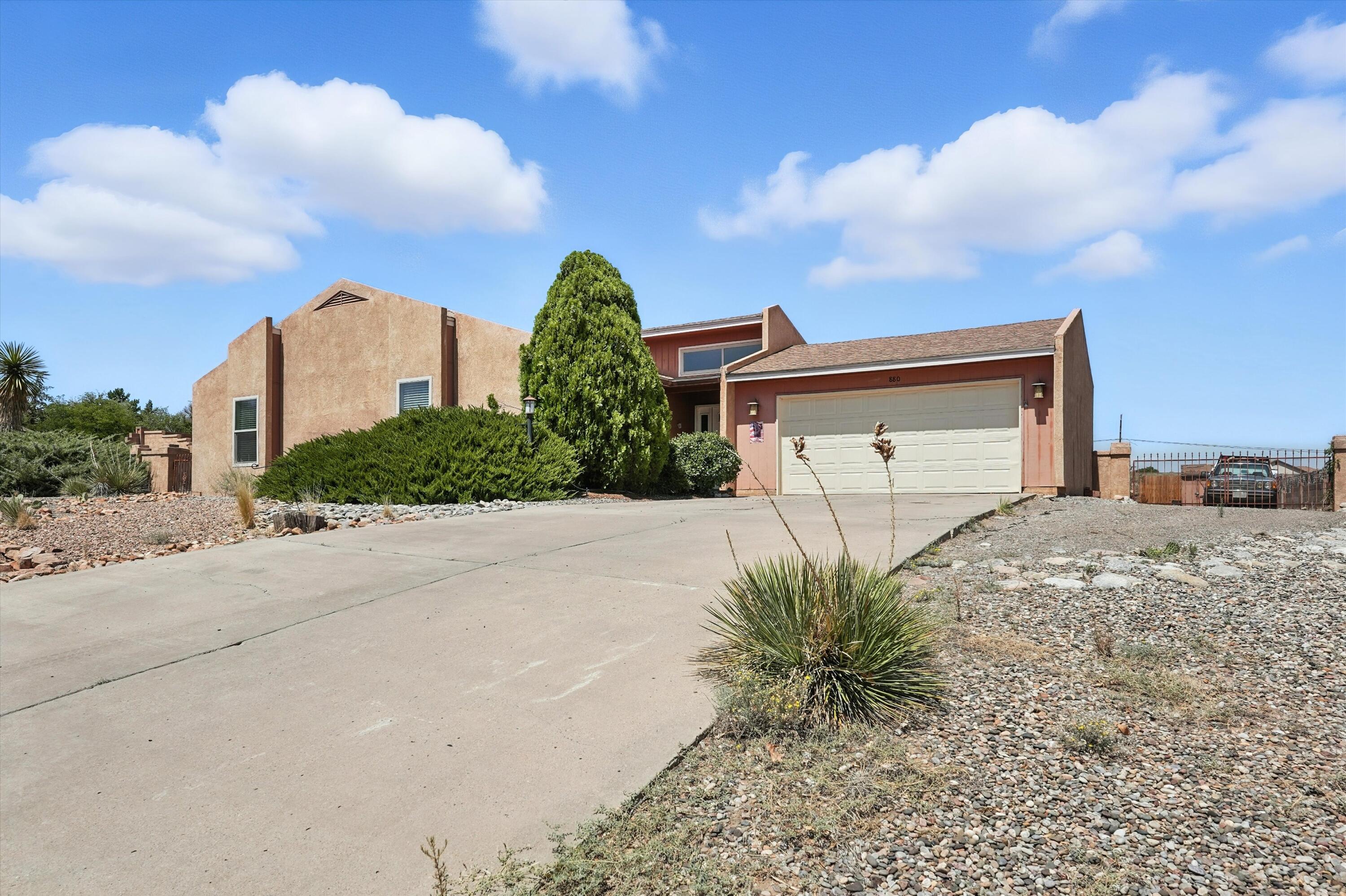 Warm & Inviting 3 bedroom, 1 & 3/4 bath single story home with an spacious 2 car garage in Vista Hills Rio Rancho. Large Corner lot with Views, Grape Vines, Desert Willows and more. Back yard access with room for an RV and all your toys. Updates in the last 10 years include a brand new HW Heater & Pellet stove in 2025; New shingle roof in 2023, stainless steel appliances, solid surface countertops, wood-look tile plank flooring in kitchen, ceiling fans, window coverings, and HVAC system with Refrigerated A/C. Convenient to shopping, River Trails, highly rated schools, and more. Directly South of Northern Blvd & East of the McDermott Athletic Center & Loma Colorado Main Library. Come see this wonderful home today, and make it your own! Lender's assistance available up to 1% of loan amount.