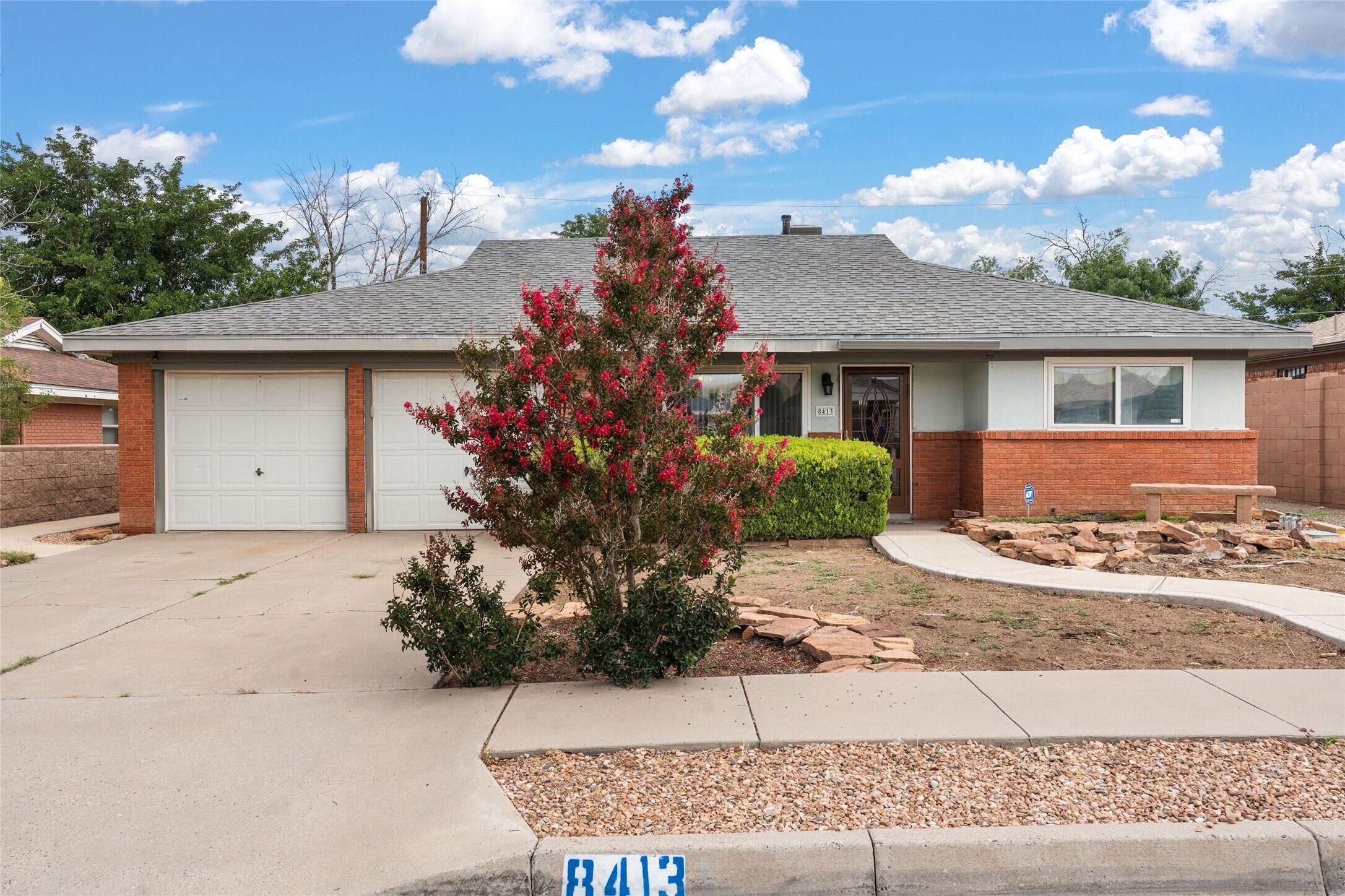 Bright & Spacious NE Heights Gem! Beautifully maintained 3-bed, 2-bath home with an open, light-filled floor plan. The spacious kitchen flows into the inviting family room with a charming brick fireplace, perfect for cozy evenings or entertaining. Durable ceramic tile runs through most of the home, while bedrooms feature plush carpet for comfort. Low-maintenance front and backyards offer room to relax, play, or garden. A large detached garage/workshop is ideal for hobbies or storage, complemented by an attached 2-car garage with pull-down ladder to overhead storage. Conveniently located near top-rated schools, shopping, parks, and transit, this home offers comfort, flexibility, and lasting value in a highly desirable neighborhood.