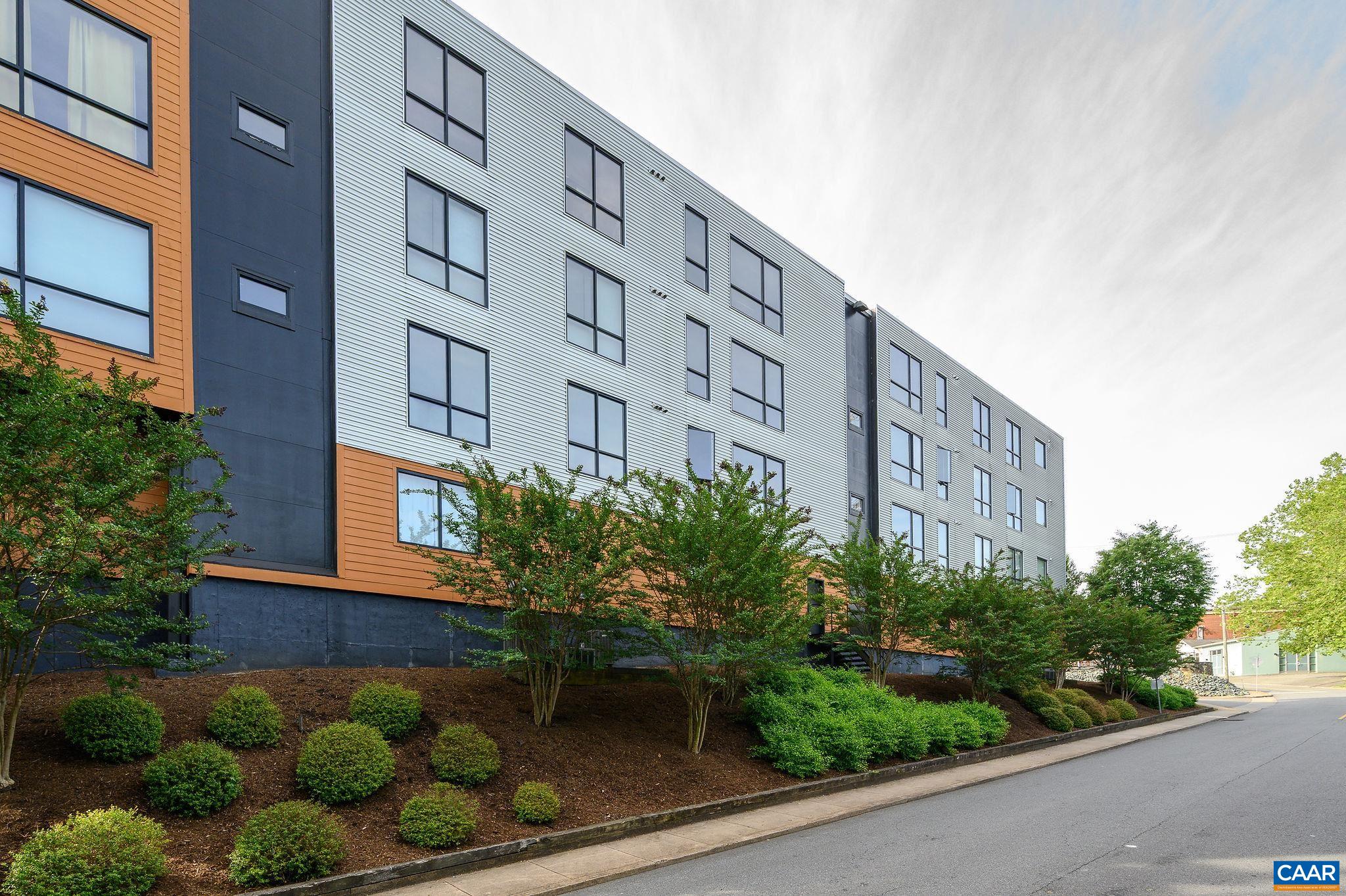 City life at its best. 97 Walk Score, 85 Bike Score. Walk to UVA or downtown, enjoy the amazing restaurants and shops along West Main Street. Freshly painted throughout. 2 ensuite bedrooms. Open plan living with separate office. Concrete, tile and carpet floors, high ceilings, oversized windows with amazing natural light on two sides allow you to enjoy the sunrise and sunset. Secure entry, elevator access, dedicated owner parking plus 5 additional guest parking spaces. Community storage room with dedicated space for bikes etc.