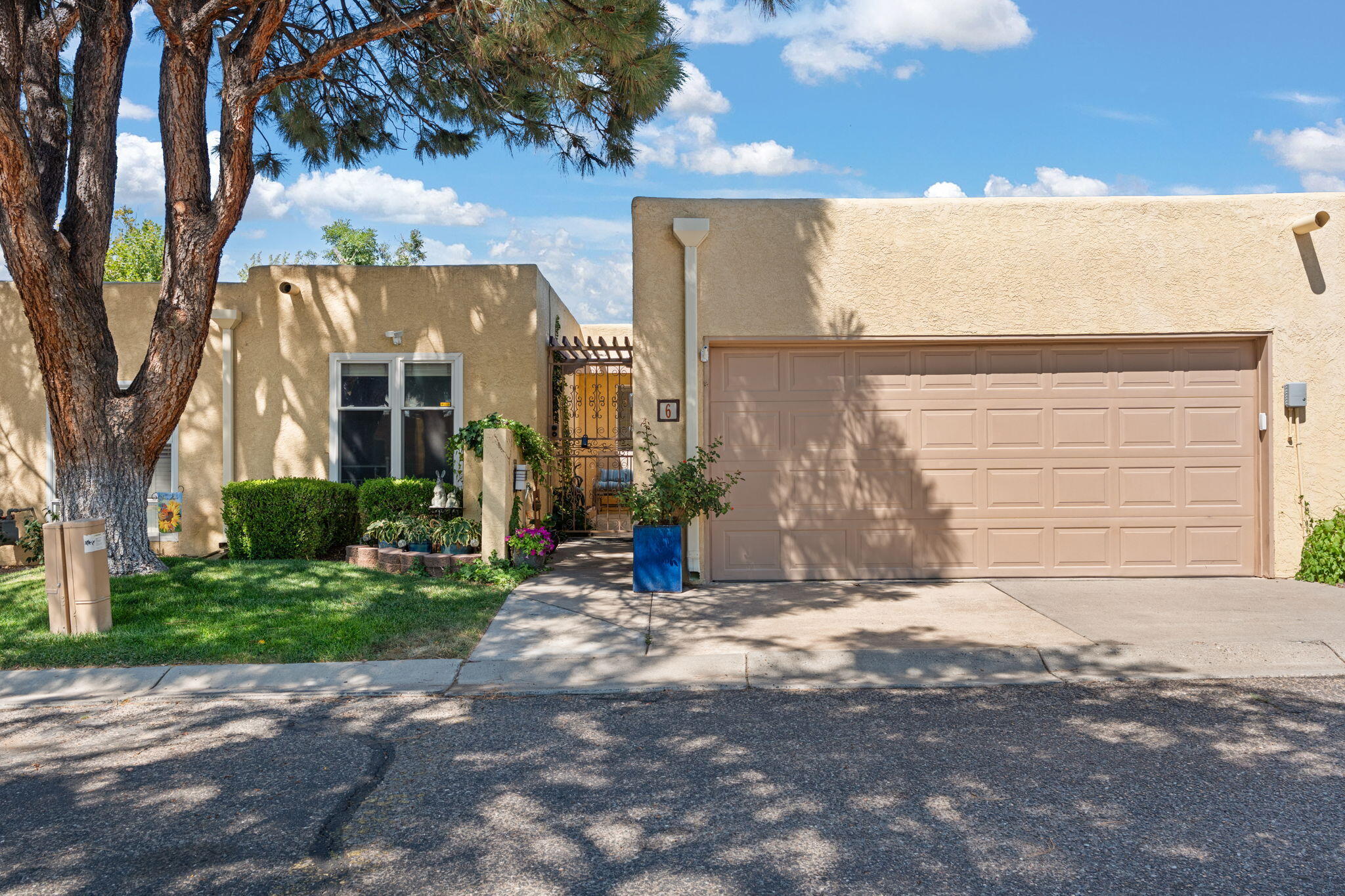 Tucked inside the El Camino Hermoso community, right next to the Arroyo del Oso Golf Course this townhouse offers great space and comfort. You'll find well-sized bedrooms, a central atrium that brings in natural light. The front yard is beautifully maintained with mature landscaping, giving the home great curb appeal. NEW REFRIGERATED AIR Community amenities include a pool for those warm days. A solid home in a quiet, established area come take a look!