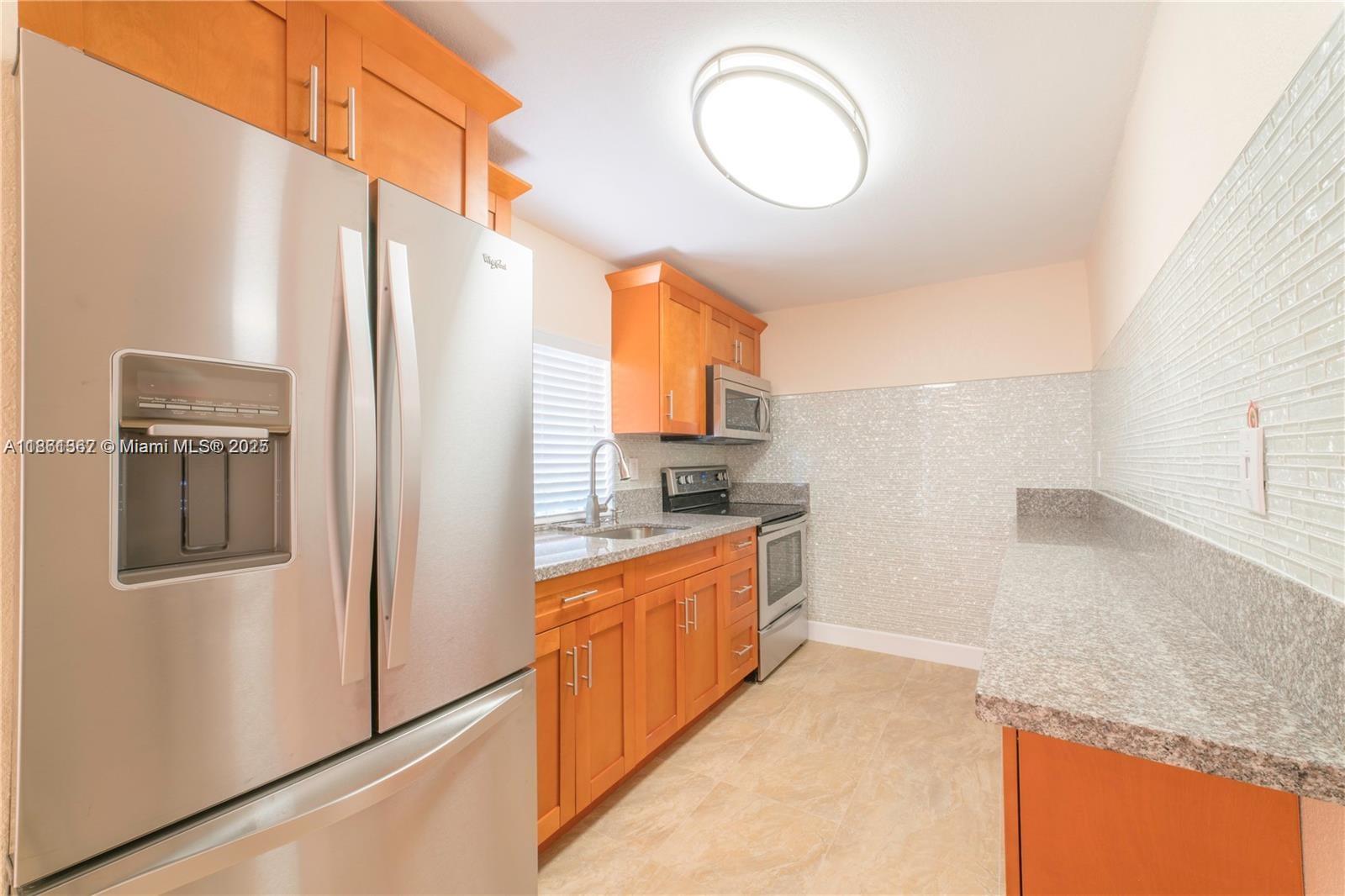 Cozy 2BR Duplex in the Heart of Miami. Beautifully renovated duplex-style unit featuring brand-new tile floors, granite countertops, stainless steel appliances, a modern bathroom, and in-unit washer/dryer. The spacious private patio is perfect for entertaining, while two reserved parking spaces add convenience.