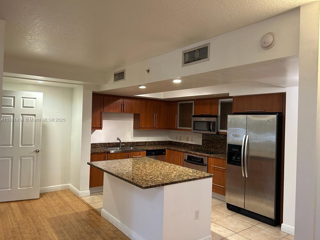 GORGEOUS 2 BR + CONVERTIBLE DEN, 2 BATH, 2 LEVEL CORNER TOWNHOUSE ON QUIET PUERTA DEL SOL FOUNTAIN SQUARE! LIGHT AND BRIGHT INTERIOR, BAMBOO FLOORS ON FIRST LEVEL SEE THROUGH ROLLER SHADES. CUSTOM MADE CLOSETS, LUXURY LIGHTING FIXTURES,PLENTY OF STORAGE SPACE, LARGE PATIO,FACING HISTORICAL COURTYARD, 2 ASSIGNED PARKING SPACES MODERN FITNESS CENTER, CLUBHOUSE AND MEDITATION GARDEN WITH RESORT STYLE POOL. EIGHT FLOOR PROMENADE WITH CASCADING WATER FOUNTAIN AND LUSH LANDSCAPING AND PANORAMIC VIEWS.
