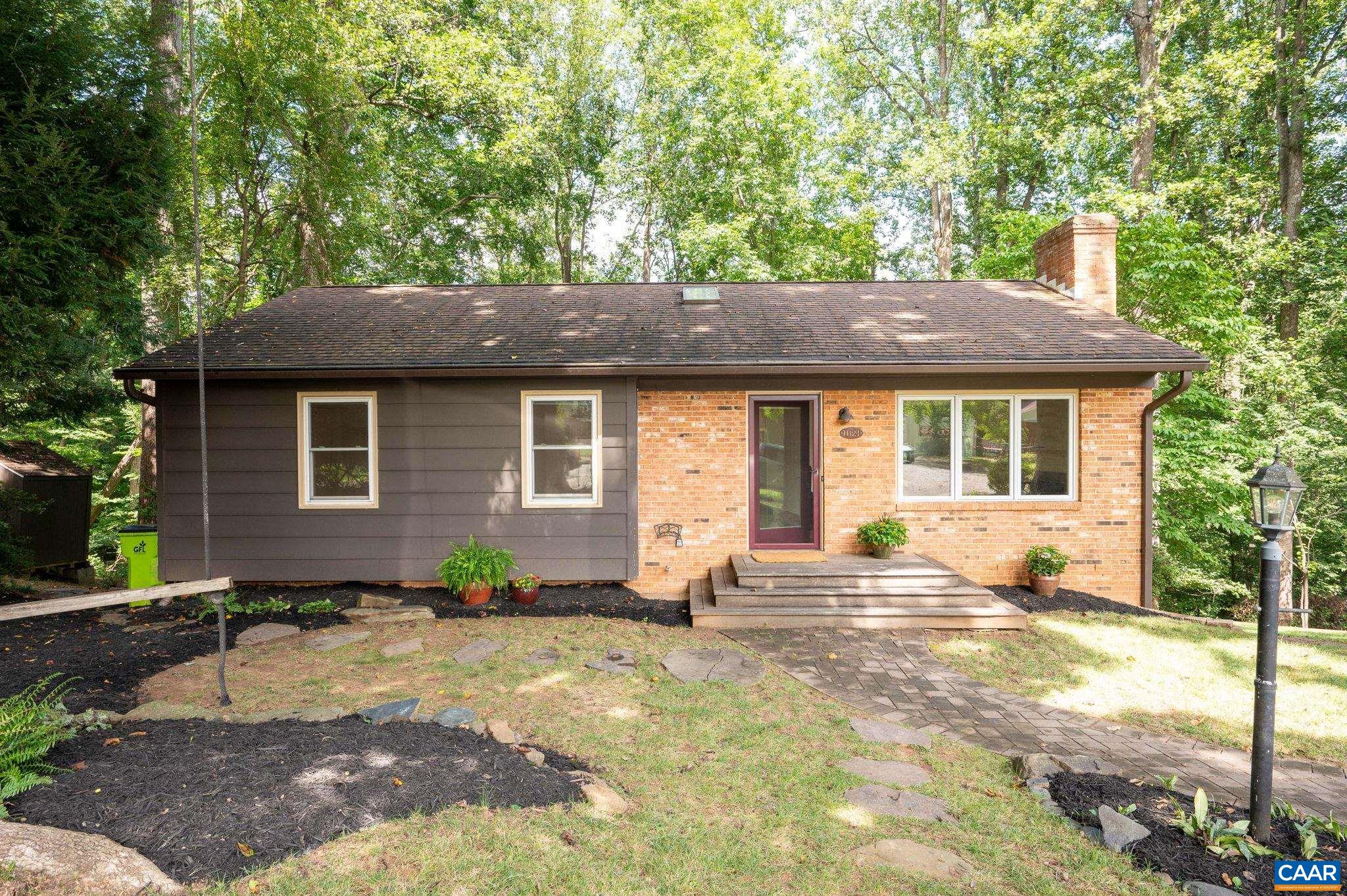 This move-in ready gem perfectly balances city convenience with natural tranquility, backing to a wooded area with access to the scenic Rivanna Trail. The beautifully updated interior offers 1 level living with recently renovated kitchen and baths. Just 2 miles from Downtown Charlottesville this conveniently located property sits on a quiet cul-de-sac with no through traffic. Updates include new heat pump '24, basement flooring '25, washer/dryer '22, Kitchen cabinets & backsplash '21, refrigerator & dishwasher '20, bathroom renovations '19, refinished hardwoods '19. Finished walk-out basement offers 4th bedroom, 3rd full bath, family/rec room, home office and ample storage. Wonderfully private screen porch provides a comfortable, protected space to enjoy the outdoors. 2 sheds for additional storage. Roof and windows were replaced by previous owner. Great opportunity at this price in the City made even better with the recent interest rate improvements!