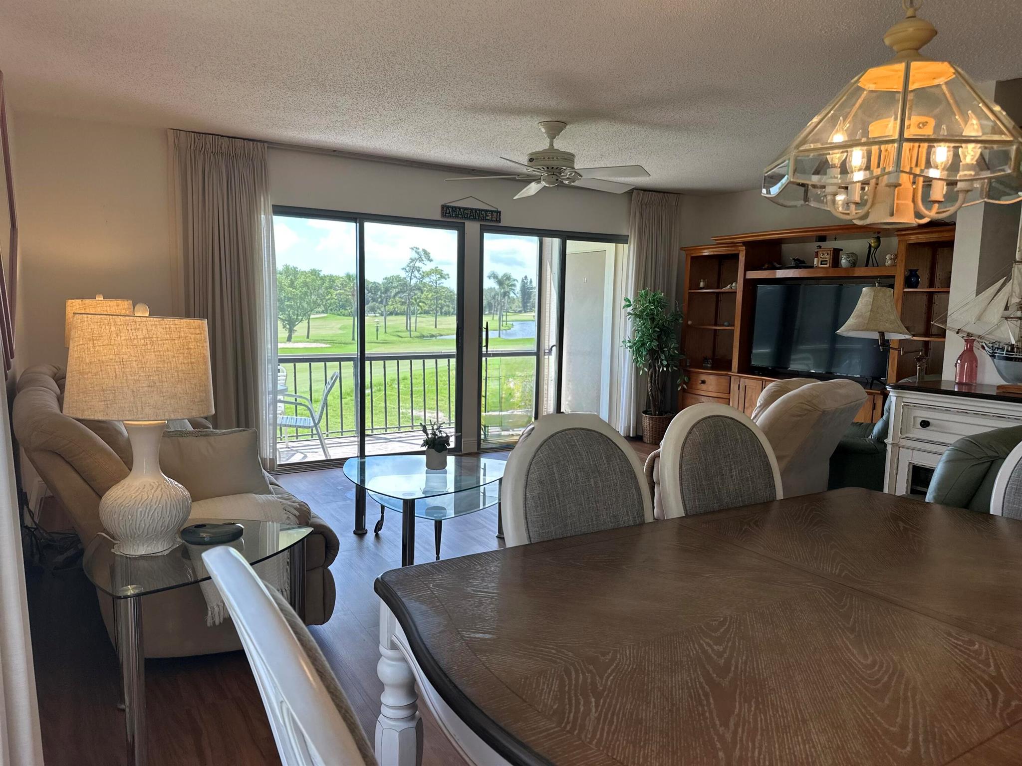 Welcome to luxury living at Riverbend Country Club! This exquisite 2-bedroom, 2.5-bathroom condo offers a perfect blend of comfort and elegance with stunning sunrise views of hole #15 and a large picturesque lake. Immerse yourself in the serene beauty of Riverbend's private golf course, designed by Tom Fazio, often hailed as the ''Jewel of the Loxahatchee.'' As you step into this meticulously maintained residence, you'll be greeted by breathtaking views. The spacious balconies, beckon you to unwind and soak in the natural beauty that surrounds. The living and dining areas feature brand new 
vinyl floors, creating a seamless and contemporary atmosphere.

Riverbend Country Club, established in 1973, is a member-owned private club that transcends mere residency. Its 18-hole golf course masterpiece, bordered by the Loxahatchee River and Jonathan Dickinson State Park, sets the stage for unforgettable experiences and lifelong friendships. Beyond golf, residents enjoy Har-Tru tennis courts, a pickleball facility, and a clubhouse with a pool, all with direct access to the Loxahatchee River.
Convenience is key, and this condo delivers. Nestled in the Village of Tequesta, it offers a tranquil retreat away from heavy traffic and noise. Benefit from lower tax rates and insurance costs in Martin County while enjoying easy access to local businesses via lightly traveled side streets. The local beach and parks are a mere 10 minutes away, and Palm Beach International Airport is just a 30-minute drive.

A wealth of amenities awaits within the gated community of Riverbend. From 24-hour security to adult and children's heated pools, lighted Har-Tru tennis courts, a pickleball facility, and a golf driving range, every day promises a new adventure. The clubhouse on the Loxahatchee River with free Wi-Fi is an ideal spot for socializing, and Riverbend Waterfront Enjoyment Club Memberships add an extra layer of exclusivity.

The social scene is vibrant, with catered dinner parties, golf leagues, tennis and pickleball leagues that even travel, and monthly Friday night potluck socials. Embrace a sense of community with activities like bingo, mahjong, bridge, art club, and book club.

In addition to the luxurious lifestyle, this condo includes equity ownership in the private golf course, and the association and golf course operate with a balanced budget&#x14;ensuring financial stability. Plus, enjoy the expertise of PGA certified golf and tennis pros, adding a professional touch to your recreational pursuits.

Indulge in the perfect blend of luxury, tranquility, and community at this remarkable Riverbend condo. Your dream home awaits!