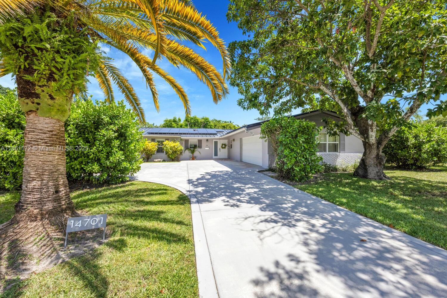 Palmetto Bay Perfection. 14701 SW 84 Ct offers comfort, lifestyle & a rare opportunity in Mangowood. Updated open-concept kitchen, perfect for pancake Sundays or impromptu entertaining.. Sparkling pool & covered wrap around patio for year-round enjoyment.  Basketball court .  And ... If at any point in time you’re ready to grow ... there ARE architectural plans for a 4th Bedroom & ensuite addition.  New Metal Roof & Solar Panels 2024.  New Septic & Drain Field.  All Impact Windows & Doors. Beautiful home, exceptional neighborhood. Tree-lined street.. Top-rated schools. Indoor laundry.. 2 car garage.. Shopping, dining, entertainment, neighborhood parks all close by. Freshly painted and move-in ready.  BEST opportunity in Mangowood.