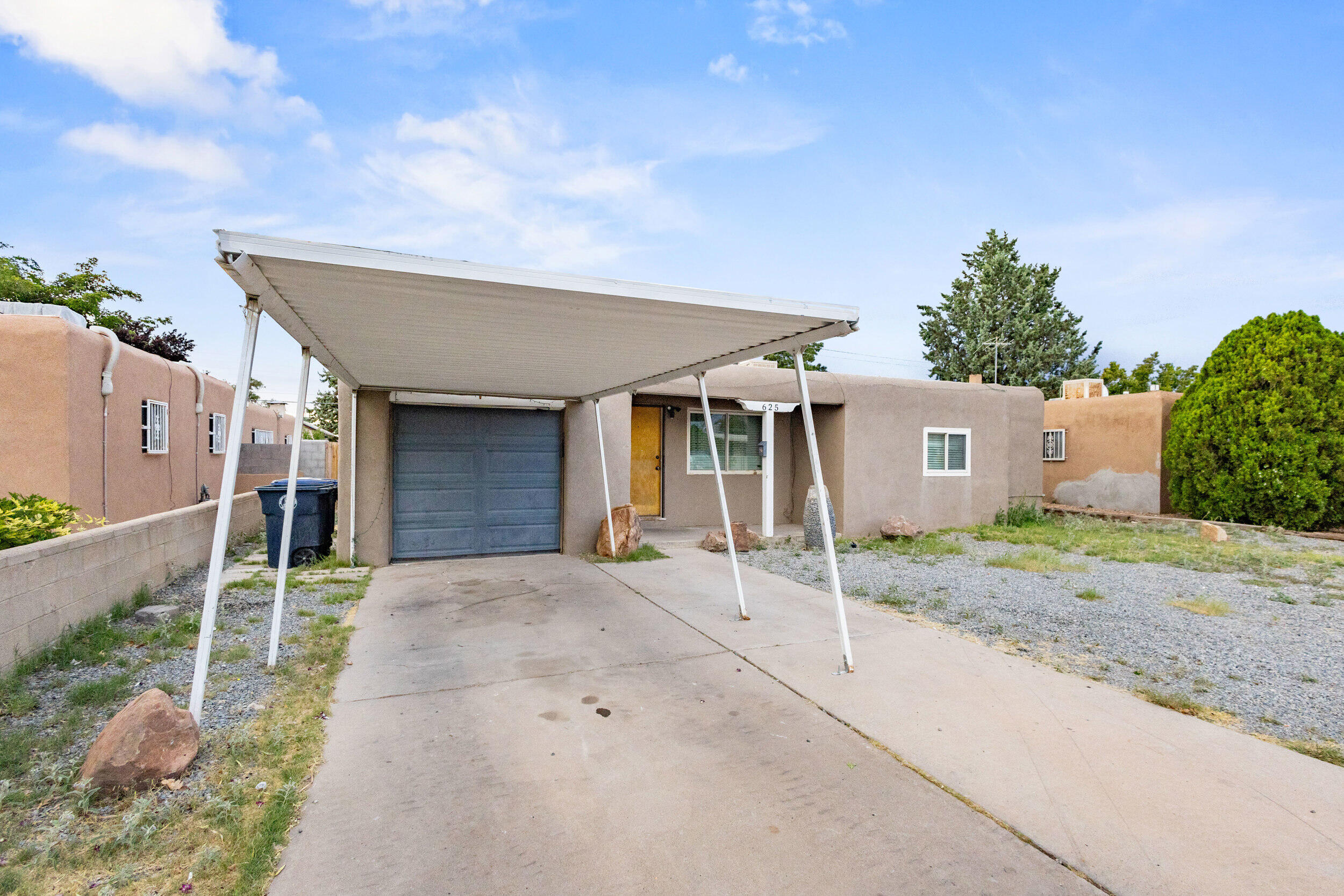 Charming single-story home in Southeast Albuquerque! This bright 3-bed, 1.5 bath residence offers approximately 1,170 sq ft of living space on a generous 7,840 sq ft lot. Features include an updated kitchen, original hardwood floors, and the perfect ''man cave'' at the garage. Conveniently located near Kirtland AFB, hospitals, and Uptown amenities, with easy access to schools and shopping. Great potential in a prime location!  TPO roof installed recently & sewer line has been replaced.