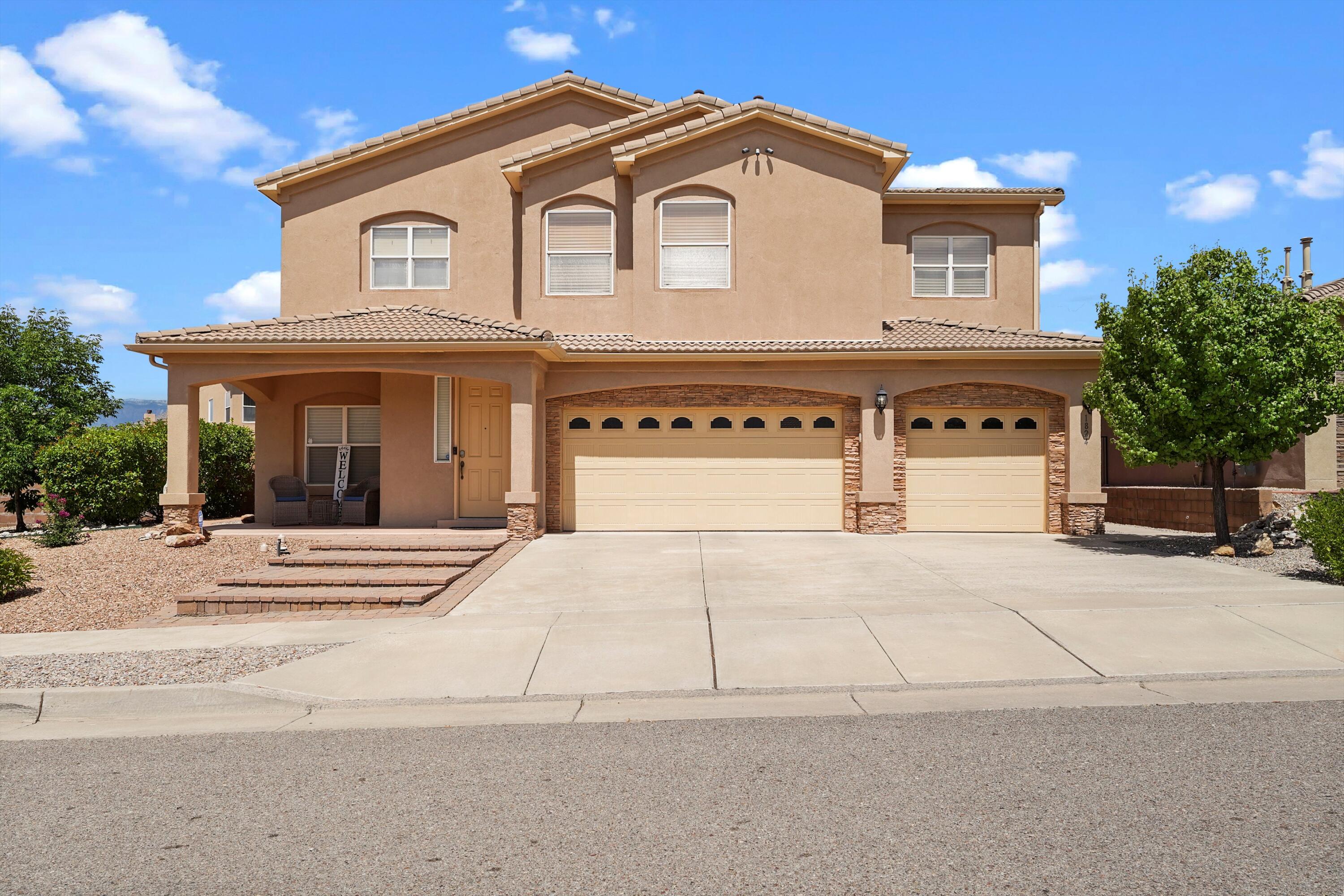 Welcome to this gorgeous 5 bed, 3 bath home in Juan Tabo Hills, conveniently located and perfect for a commute to Kirtland AFB! It has been meticulously maintained & that is evident everywhere you look! The floor plan offers so many options, boasting two large primary suites, one of which is on the main level. There are three living areas & a wonderful open concept, making it perfect for entertaining! The kitchen is truly a chef's delight, with the centerpiece being a six-burner, Wolf range & a custom, hand crafted hood. The beautiful quartz countertops, large island, Bosch SS appliances & custom cabinets are exactly what you would dream your kitchen to be. Rounding it out is a huge, walk-in pantry!