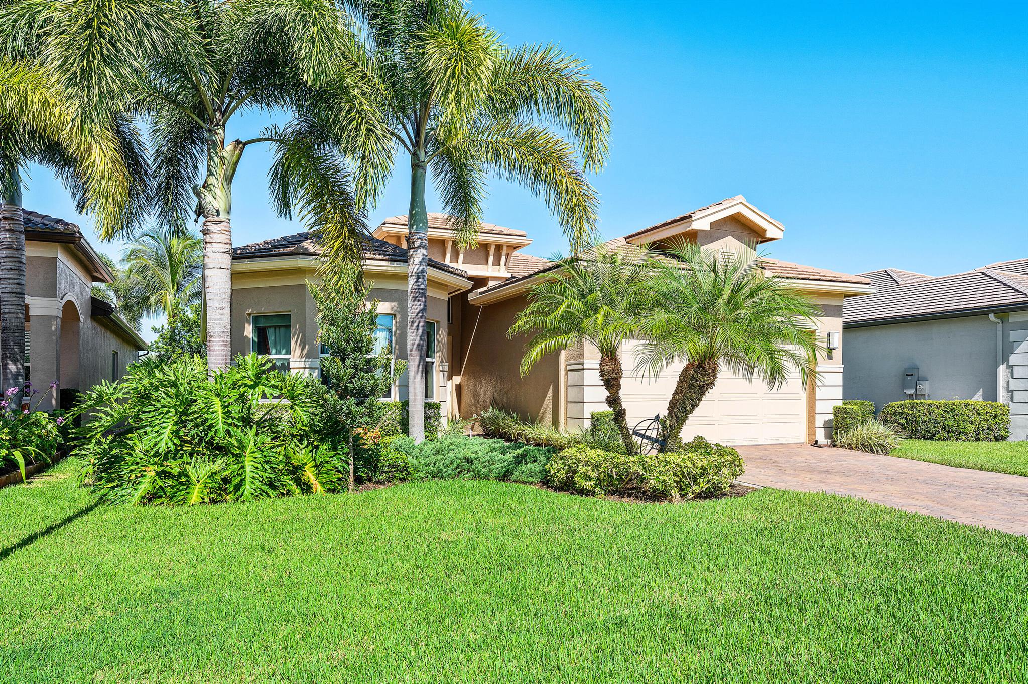 This lushly landscaped 3 bedroom + den, 3 bath Bimini model sits on a lovely lakefront lot. Features include impact windows, open floor plan, tile in main living areas, recessed lights, upgraded baths and more! The gourmet kitchen has white wood cabinets, quartz countertops, glass tile backsplash, built-in pantry cabinet, stainless steel appliances and the convenience package which includes a built-in silverware tray, tray cabinet, pullouts, drawers, and trash and recycling cabinet. Enjoy the separate breakfast area and snack bar for casual dining. The dining room is perfect for holiday dinners. The great room is open to the kitchen and dining room. The master bedroom has outfitted closets and a luxurious bath. You'll love sitting on the covered, screened patio overlooking the lake. Valencia Bay is a premier 55+ lifestyle community featuring a spectacular 33,000 square-foot clubhouse and 8 acre outdoor recreational facility. Endless activities and opportunities for fun abound - there are activities, trips, shows, and clubs of all types. The clubhouse features an expansive foyer and lobby, grand ballroom with raised stage, dance floor and two small bars, three spacious card rooms, Arts and crafts room with kiln, Billiards room/internet, Catering kitchen, Cooking studio, Men's and women's locker rooms with showers, Yoga &amp; exercise studio and separate, fully equipped fitness center. There is a Cafe with indoor/outdoor seating and a large pool bar. There are three pools - a beautiful Resort-style pool with Swimmers' Lap Lanes and Shade Pavilions, Resistance walking pool, Grandchildren's wading pool, and an Outdoor whirlpool spa. There are six har-tru tennis courts with shade pavilions, tennis pro shop, tennis pro, league play, six pickleball courts with league play, 2 bocce courts, 2 handball courts, half-court  basketball and walking/jogging/biking paths throughout and just outside the community. Valencia Bay is conveniently located near shopping, restaurants, houses of worship and major highways!