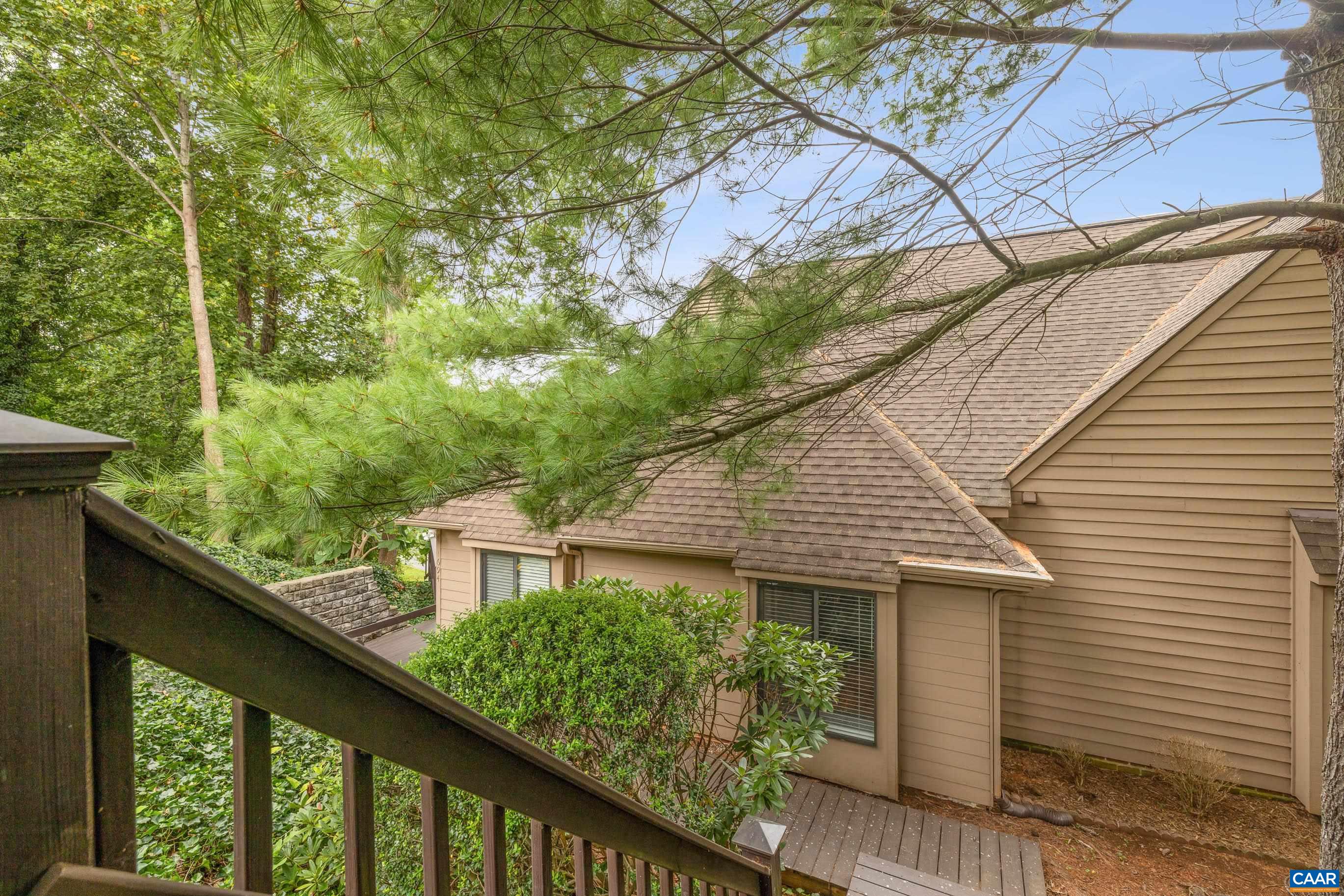 Ideally located and extraordinarily private, this one-level home is completely updated with hardwood floors in the living and dining areas, ceramic tile in the kitchen and baths, and stainless appliances. A large, 490-square-foot, custom-built deck is perfect for outdoor entertaining. The master bedroom has its own private balcony facing west with wonderful winter views, two closets, a spacious bath, and a conveniently located washer/dryer. Enjoy easy access to the outdoors with a short walk to the Biscuit Run Park trails. The neighborhood HOA provides peace of mind by covering roof, siding, exterior painting, and grass mowing. All of this is less than 5 minutes from Wegmans, 5th Street Station shopping and dining, three miles to the UVA Medical Center and Historic Downtown Mall, and less than 15 minutes to Martha Jefferson Hospital on Pantops. The home is surrounded by vineyards, historic landmarks, and walking trails. OPEN HOUSE Sunday, September 7th from 2 PM - 4 PM!