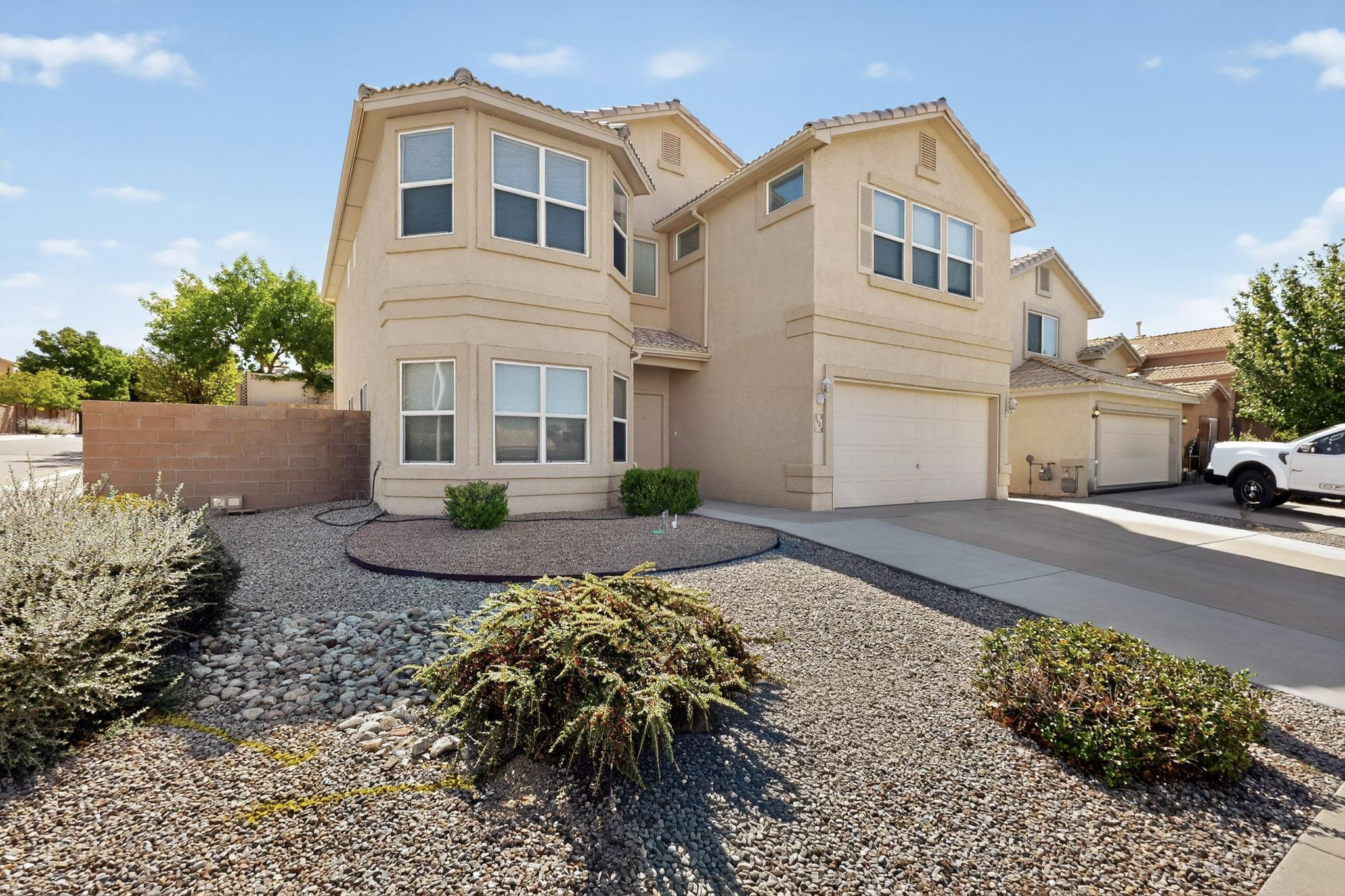 Welcome to this beautifully maintained two-story home. New roof, stucco, appliances $ fixtures. Located in one of Albuquerque's most sought-after neighborhoods! Boasting 4 bedrooms, 3 full bathrooms, and over 2,800 sq ft of living space, this home offers comfort, functionality, and an ideal layout for both everyday living and entertaining. Inside you'll discover two spacious living areas, perfect for relaxing or hosting guests, along with a cozy gas fireplace adding warmth and charm. The open-concept kitchen and dining area. Upstairs, you'll find a versatile loft space, along with generously sized bedrooms, including a spacious primary suite with sunset views, a private bath and large closet. Conveniently located near top-rated schools & shopping centers.