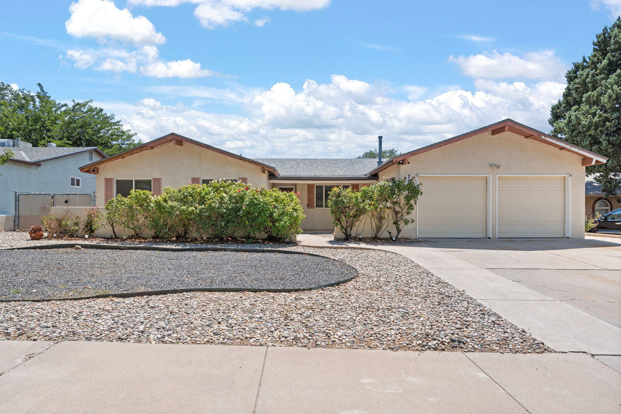 Welcome to 7000 Esther Ave NE, a beautifully maintained single-level home in Albuquerque's Northeast Heights. With 4 bedrooms, 2 baths, and nearly 1,800 sq. ft., this property offers plenty of space for a growing family or those working from home. The inviting living room with fireplace flows into the dining area and kitchen featuring granite countertops and custom cabinets. A flexible sitting room provides options for an office, playroom, or hobby space. Outside, enjoy a sizable backyard and side yard with mature landscaping and two Tuff Sheds for storage. Recent updates include a roof and AC unit approx. 4 years old. Located near shopping, dining, parks, and top-rated private schools such as Albuquerque Academy and HOPE Christian, this home blends comfort, convenience, and location.