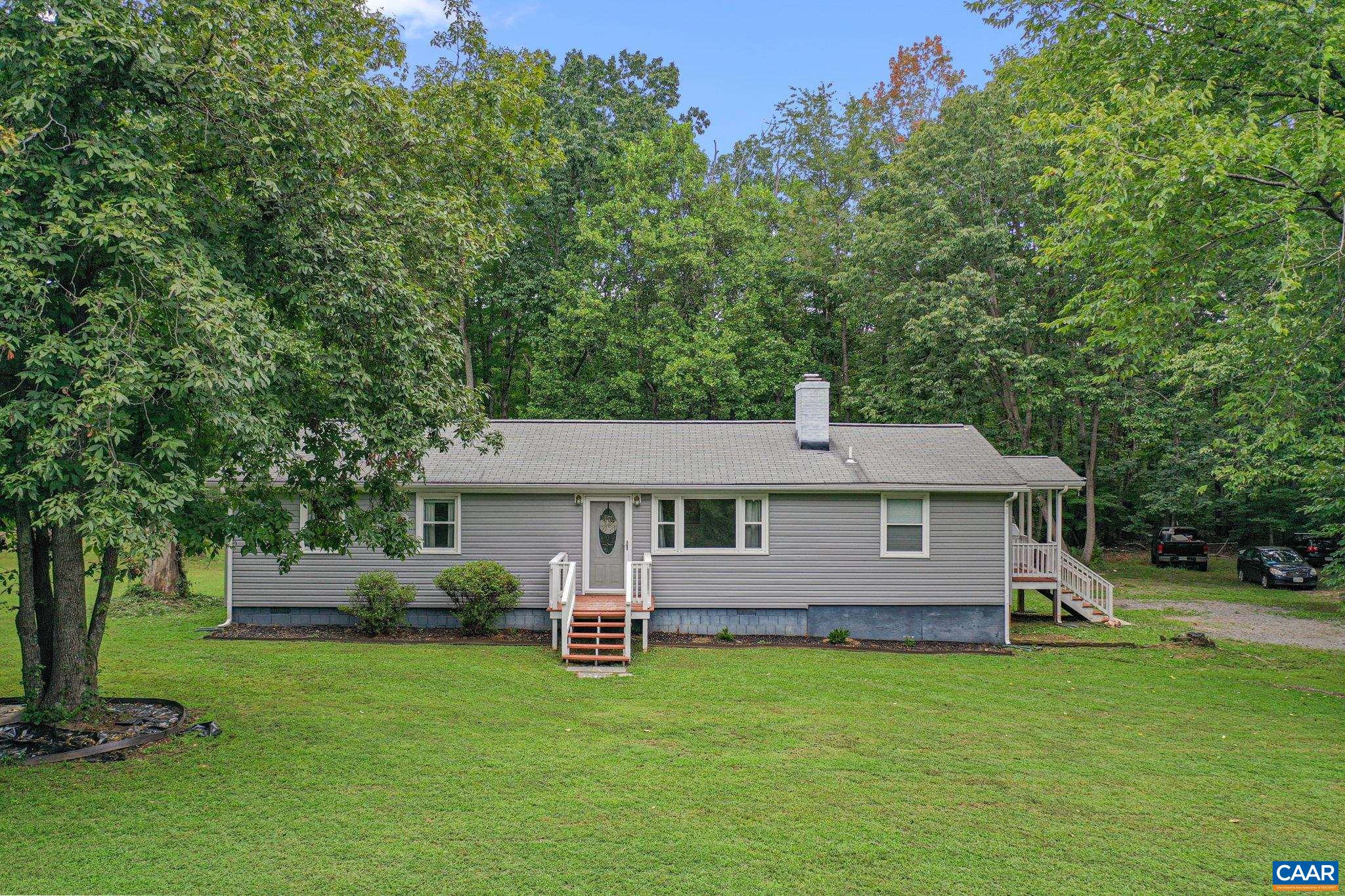 Move-in ready 3 bed/1.5 bath ranch with recent updates, including new laminate flooring, vinyl siding, and a fully encapsulated crawl space for peace of mind. The spacious, level backyard offers endless possibilities for outdoor enjoyment - perfect for gardening, gathering, or pets. Enjoy a quick 12-minute commute to downtown Scottsville and just 25 minutes to Charlottesville