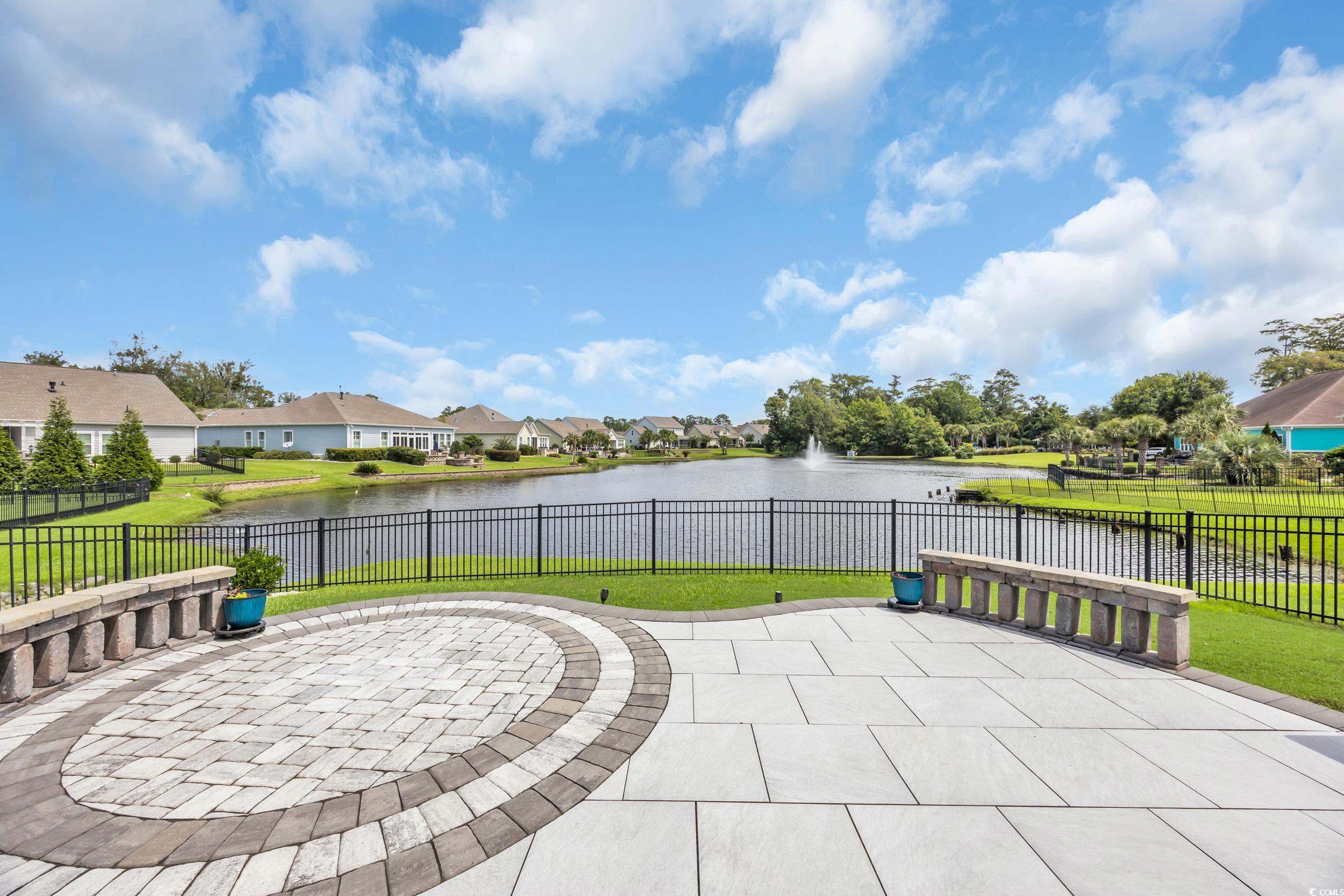 View of patio with a water view and a residential view