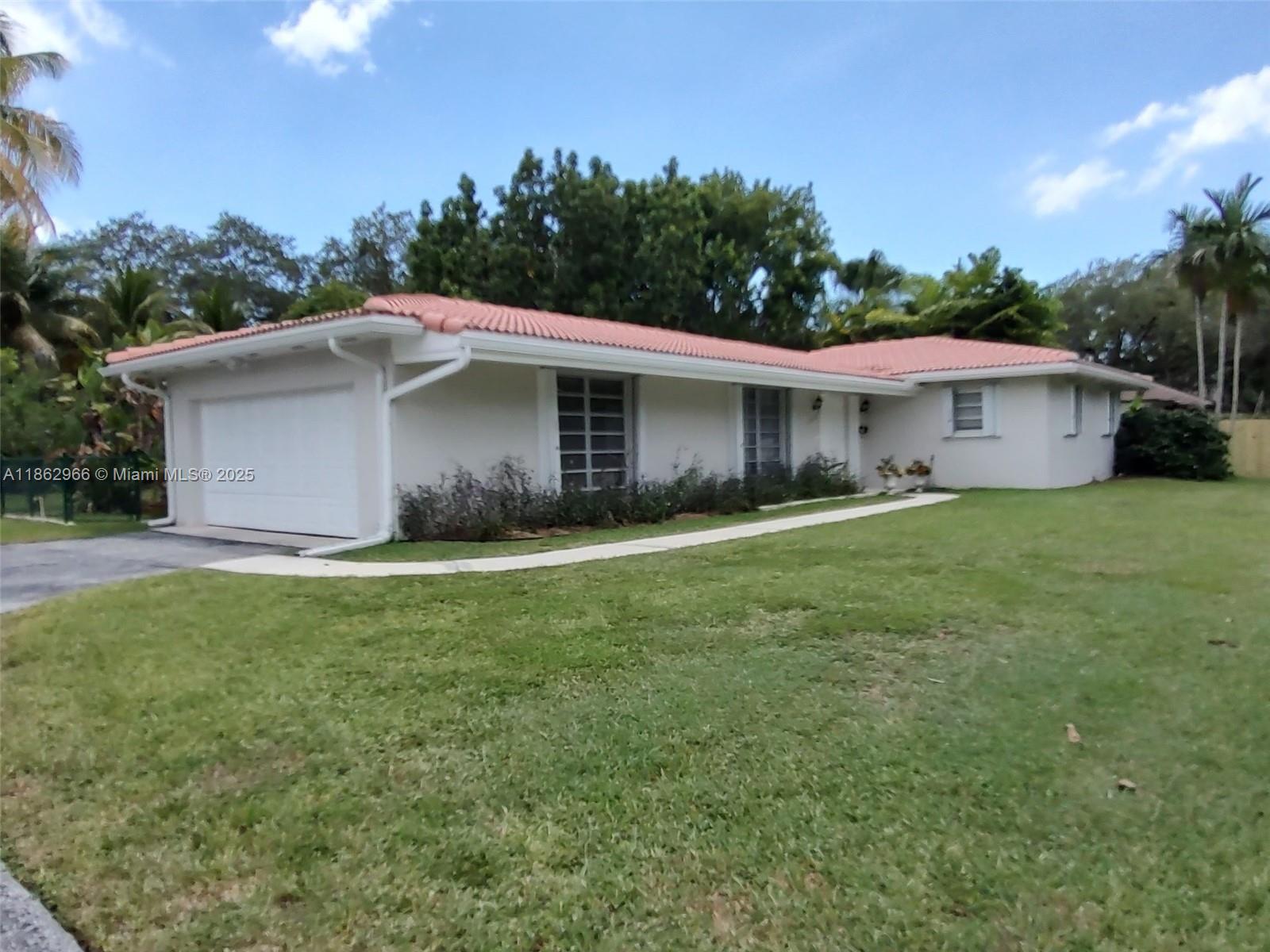 Lovely Palmetto Bay home for rent off Old Cutler Road. Family friendly neighborhood minutes from shops, restaurants, parks and walking trails. The home features 3 bedrooms, 2 bathrooms, 2-car garage and sits on a 16,500 sq ft lot. Interior features include updated kitchen and updated bathrooms, custom closet organizers, and terrazzo floors. Exterior features include new fencing, accordion shutters, gutters all around, sprinklers and mature landscaping in the back yard. Home painted in 2022, both interior and exterior as well as new water heater in 2022