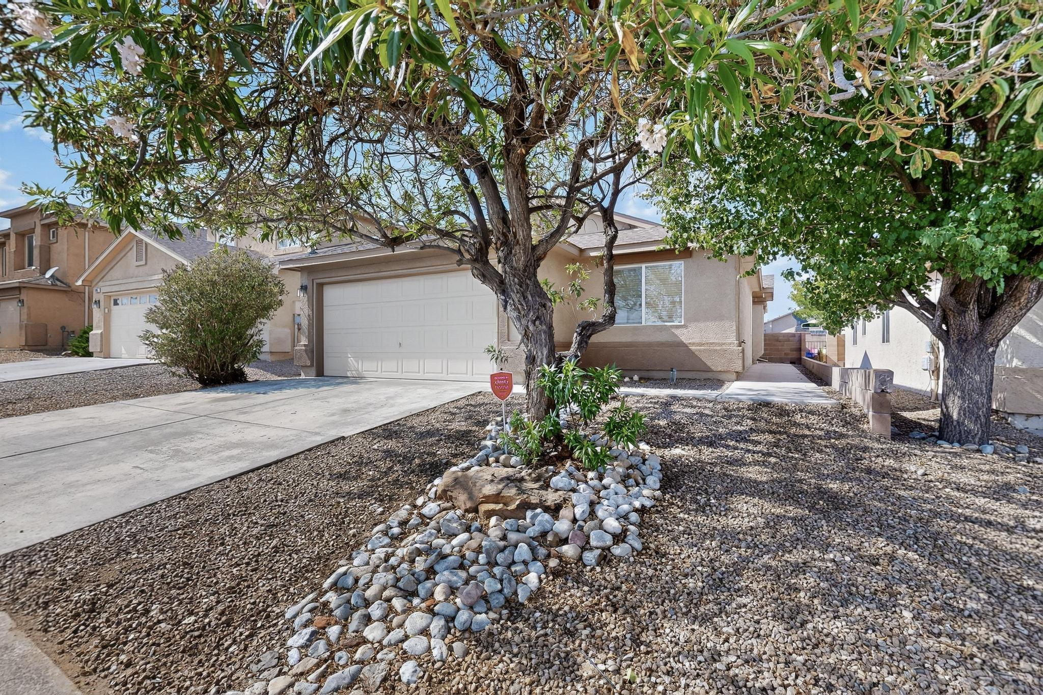 Welcome to this 3 bed, 2 bath, 2 car garage,  1,368 sq. ft. popular floorplan, in a secure gated neighborhood, located right across the street from a park!Open floor plan with vaulted ceilings, tile floors (no carpet!), and a cozy gas fireplace that makes the living space feel warm and welcoming. The kitchen comes fully equipped with a gas stove, microwave, refrigerator, and pantry, ready for your culinary creations. Enjoy refrigerated air for cool summers and year-round comfort.The spacious primary suite is a true retreat, featuring a walk-in closet, double sinks, and a separate tub and shower. For added privacy, the guest bedrooms are thoughtfully separated from the primary suite, making the layout ideal for families, guests, or a home office.