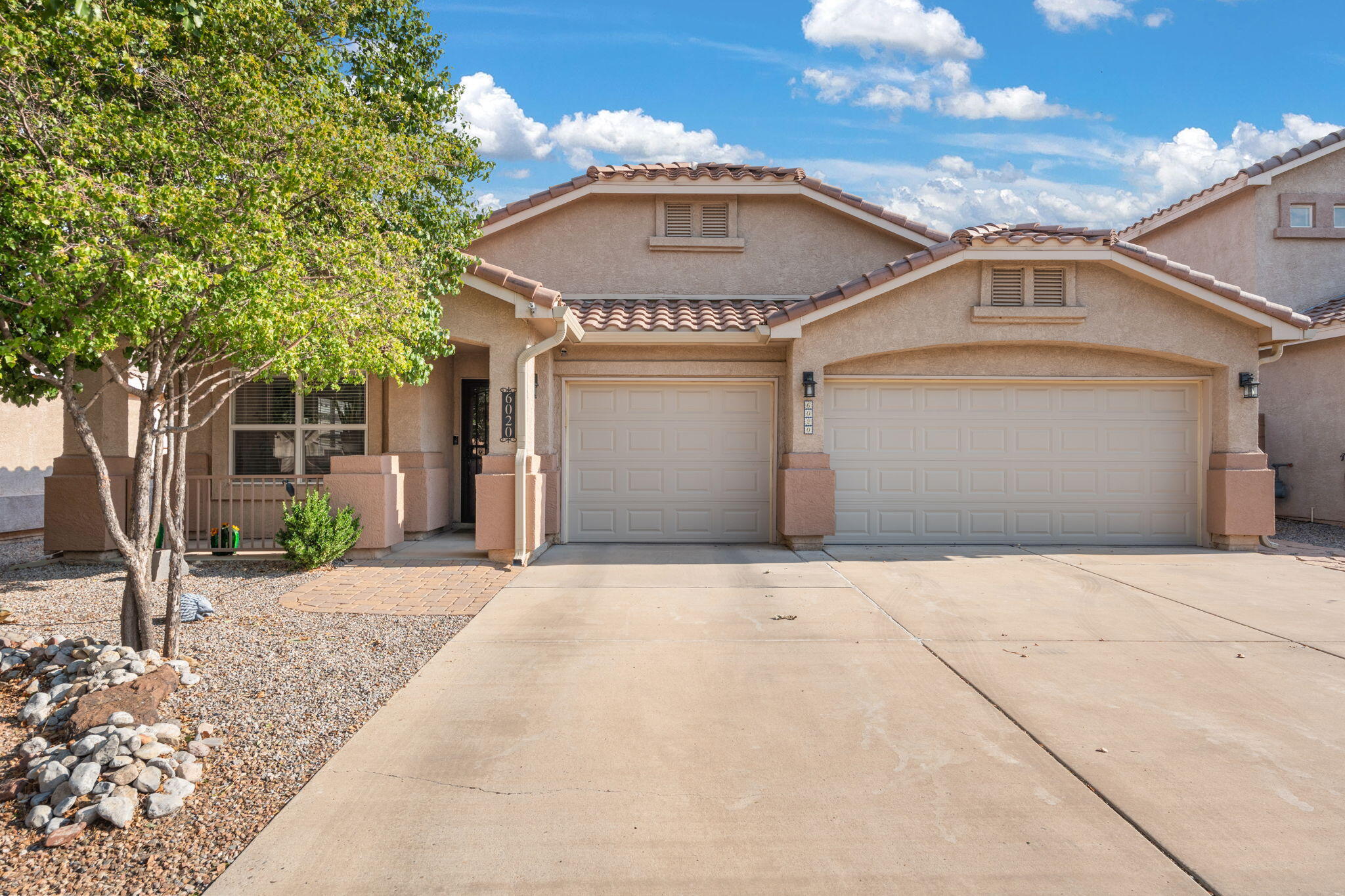 Beautiful single-level home with a bright, open layout and great flow for everyday living. Two spacious living areas and a breakfast nook provide plenty of room to gather. The kitchen offers abundant storage and counter space, opening to a cozy family room with a gas fireplace. Primary suite features high ceilings, natural light, and a spa-like bath with dual vanities, garden tub, and separate shower. Recent updates include new LVP Coretec flooring - 100% waterproof, kid proof, pet proof throughout main living areas, new carpet in bedrooms, and a new Carrier 2-stage heater with refrigerated A/C. Washer, dryer, refrigerator, and microwave all stay. Finished 3-car garage plus a landscaped backyard with covered patio, pergola, and storage building--perfect for relaxing or entertaining.