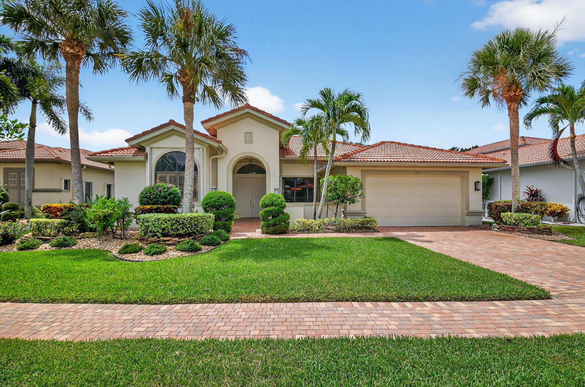 Rarely available Classico model is awaiting new owners.  Will you be the lucky one?  This light and bright 4 bedroom home has 2 1/2 baths and a 2 car garage.  Situated on a lot with a beautiful lake view you can relax and enjoy those special moments with family and friends.  The kitchen is equipped with granite countertops and 42'' wood cabinets.  A newer french door refrigerator and dishwasher were recently installed.  Both bathrooms, and the powder room, have granite counters.  The primary bath has a separate shower and jacuzzi tub.  This almost 2800 sq ft home has a formal dining room and separate living room and family room.  The 4th bedroom is currently set up as an office, but has windows, closet and door. The 3rd bedroom has been expanded in size and gives the feel and comfort of a primary suite.  This home has dual zone air conditioning with both units being installed in 2019.  Both have a 10 year transferrable warranty.  The water heater was also installed in 2019.  
Four Seasons at Delray Beach is an active community providing many amenities to keep you as busy as you want to be.  Enjoy playing tennis, pickle ball, bocce at the Sports Center or working out in the state of the art fitness center.  The clubhouse was renovated a couple of years ago and provides card rooms, a massive ballroom for shows and parties and a beautiful gathering area to relax and enjoy good times with your fellow residents.  Close to the Delray Marketplace and a short drive to downtown Delray Beach, you will find great restaurants and shopping.  Four Seasons is located between two major airports and major highways.  Come see everything Four Seasons has to offer before making your buying decision.  You will not be disappointed.