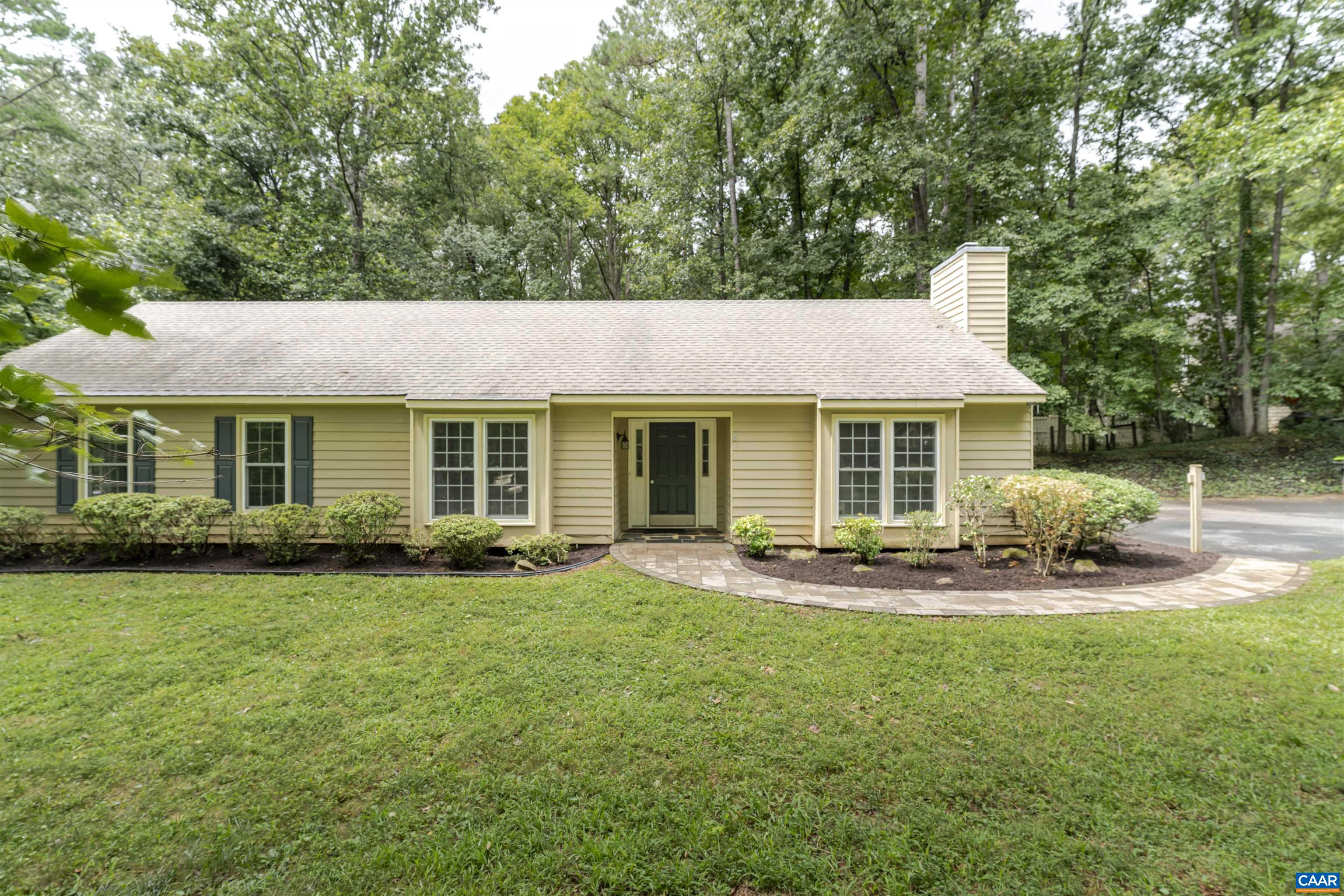 Set on a private one-acre lot at the end of a quiet cul-de-sac, this move-in ready, one-level home offers over 2,000 square feet of comfortable living in a natural setting. Just minutes to shopping, dining, and schools, the popular Earlysville Forest neighborhood offers miles of scenic hiking trails and tranquil ponds for a peaceful retreat with endless outdoor recreation. The spacious floor plan includes four bedrooms and two primary suites, one with an impressive extra-large addition. Enjoy both formal and casual living with a light-filled eat-in kitchen, formal dining room, and a flowing layout that opens to a large rear patio—perfect for entertaining or relaxing. Outside, the expansive yard is enhanced by fresh landscaping and inviting stone pathways, all framed by mature trees for privacy. Recent updates include new hvac including heat pump and cleaned ducts, interior painted, shed w/ new flooring and electric, updated hall bath, and septic pumped in August. Move in time to enjoy the stunning fall foliage on this sprawling property.