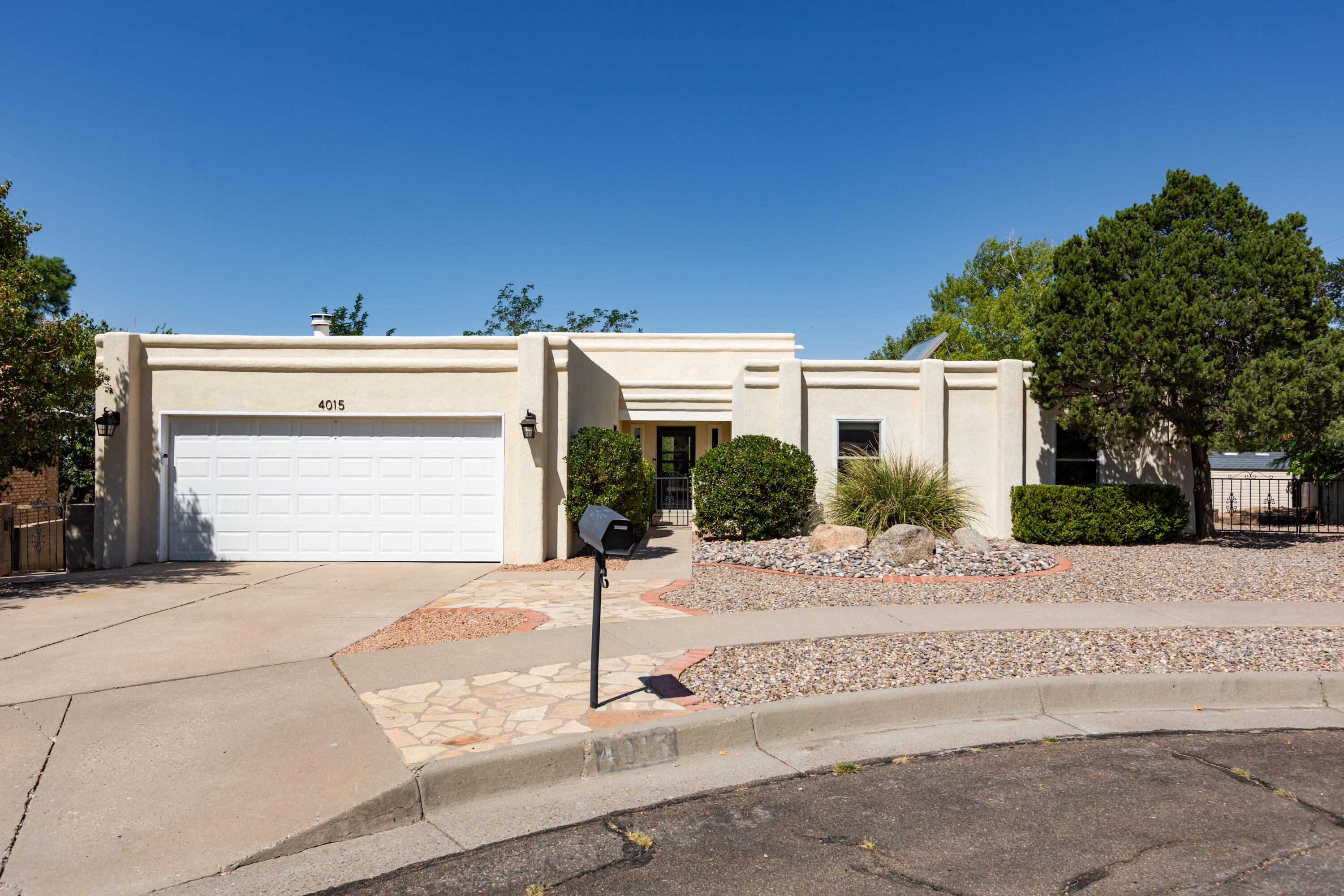 Step into this beautifully renovated 4-bedroom residence where thoughtful upgrades and a fantastic open floorplan create the perfect blend of comfort and style. The remodeled kitchen (new cabinetry, quartz countertops, and a stylish tile backsplash), contemporary 20x20'' porcelain tile flooring, and updated bathrooms are impressive. Anderson windows, 7 skylights, and high ceilings in LR/DR area amplify the sense of space and light. Tankless water heater/seller-owned water softener & filtration system, synthetic stucco, new front door & storm door (2024) ~ so many updates!  VIEWS! Conveniently located close to the mountains, shopping, schools, and restaurants. Make an appt with your realtor to see this  special home today!