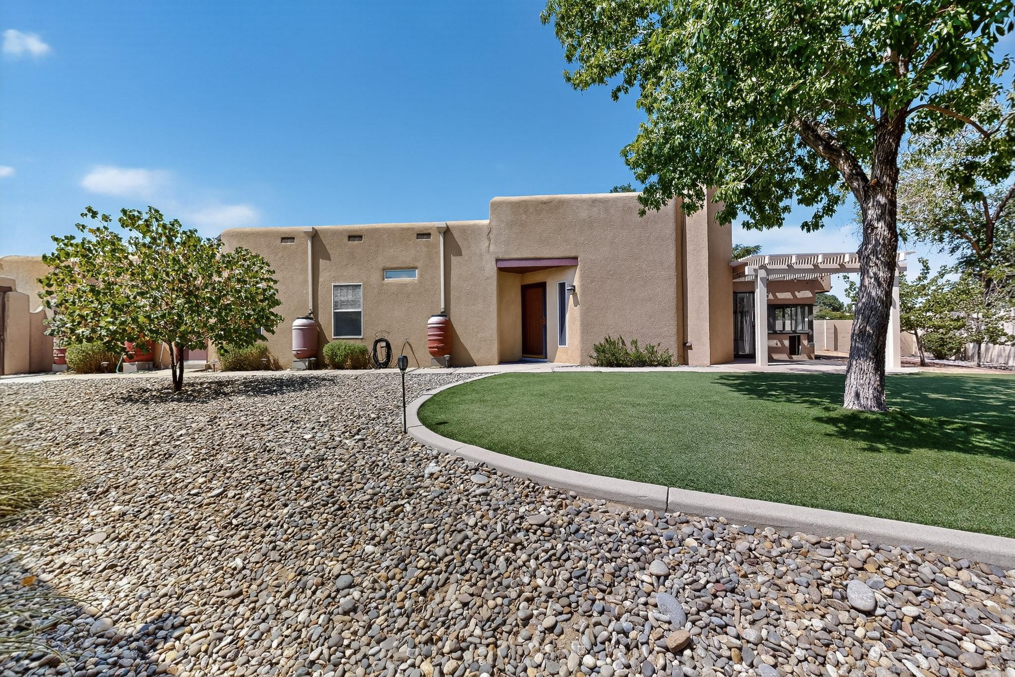 You gotta see this gem of a home! Single story home nestled in lovely Saratoga subdivision of Taylor Ranch. Cul-De-Sac location means this has a large fully enclosed yard.  You'll love the privacy this affords! This kitchen has been renovated to include granite counters, high end KitchenAid appliances & new cabinetry!  Master bedroom has high ceilings, barn doors & attached sitting room w private courtyard that includes Crimsafe Security Screen overhead for added security! Bedroom 2 w ensuite bath. Sunroom provides an additional living space & the pellet stove can be used to reduce heating costs & add ambiance. Low maintenance yard w turf, includes rain water harvest system & a Tuff Shed. Pride in ownership is evident in every aspect of this immaculate home + Summers are a breeze with AC!