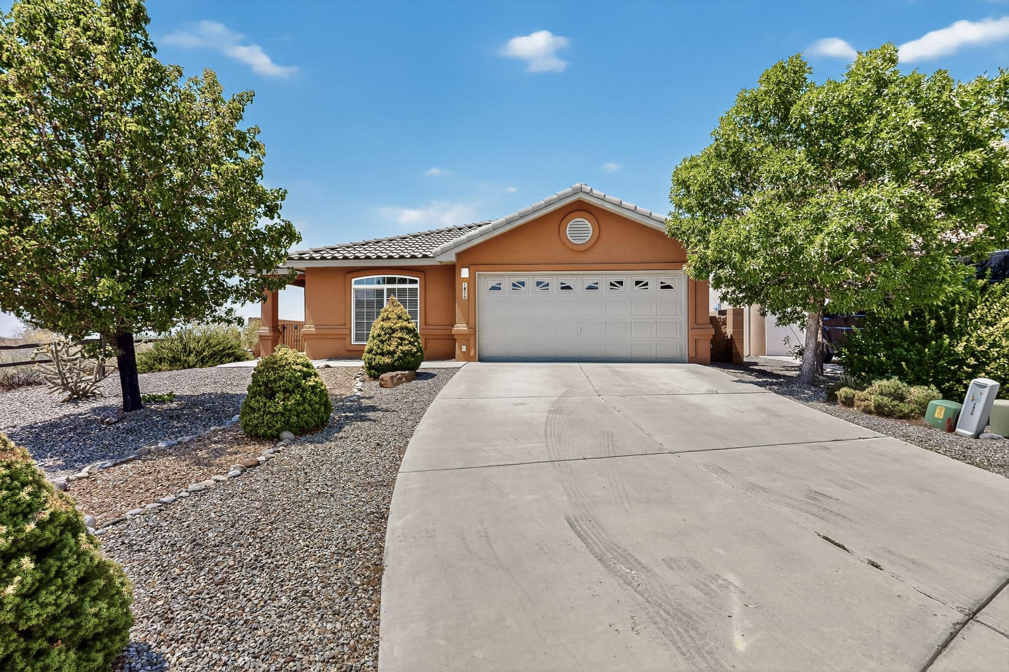 Welcome to this move-in-ready single-story home in the desirable Volterra community. Offering 4 bedrooms and 2 full bathrooms, the flexible floor plan includes a 4th bedroom that can serve as an office or study. The spacious and functional kitchen features granite countertops, stainless steel appliances, a pantry, and seamless flow into the dining area and two spacious living areas. A cozy fireplace adds warmth and charm. The private primary suite is a true retreat with a garden tub, separate shower, dual sinks, and a generous walk-in closet. Outside, enjoy a large landscaped backyard with grass, a covered patio, and beautiful west-facing views, perfect for relaxing or entertaining. The home backs up to open space with trails, offering added privacy and access to the outdoors.