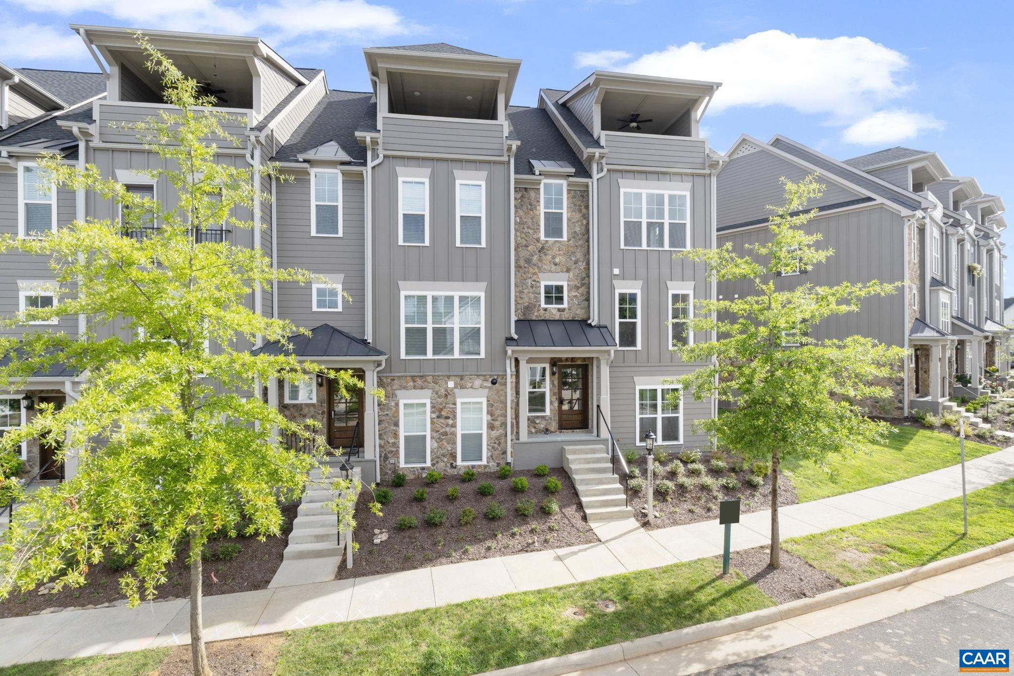 Move-In Ready, End-Unit Townhome with Rooftop Veranda and Blue Ridge Mountain Views! This End Unit Towne includes 4 Finished Floors, Residential Elevator servicing all 4 Floors, Rooftop Veranda and potential rental income with 1st Floor Bedroom/Bath dependency/ADU. This townhome is designed to capture the beautiful Crozet views while incorporating thoughtful, included features and spacious living spaces throughout. Starting with a 2-Car Garage, finished bedroom and full bath dependency/ADU on the lower level, you can head to the open 2nd Level for entertaining in your Kitchen, Great Room with Fireplace, Dining Room & spacious Trex Screened-In Deck (plus a half bath!). The 3rd Level is home to the private Owner's Suite & Bath, second bedroom, full bath and Laundry Room. The 4th Level comes with a finished Rec Room, full bath, Private Study & show-stopping Veranda. Located in amenity-filled Old Trail, you can enjoy all that this neighborhood & Crozet have to offer!