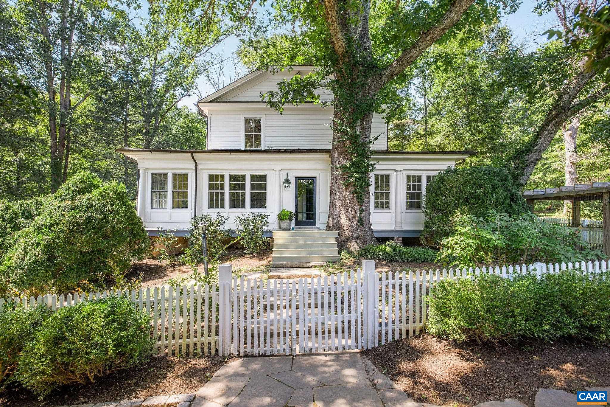 "Twenty Columns" is a rare opportunity to own a piece of Virginia history. Originally constructed for the 1907 Jamestown Exposition, the home was relocated by train to Esmont, where it is set on 18.5 acres of lush, private land. The home features a perfect blend of original architectural details and modern amenities, including a Hallman 48” gas range, oversized soapstone sink and marble countertops. Enjoy expansive views of the surrounding nature from the wrap around porch and through large picture windows. The outdoor space is ideal for relaxation and entertaining, featuring a built-in pool, fire pit and walking trails that lead to a peaceful creek. With gardens, wooded areas and open lawns, the property provides both beauty and privacy, while being less than 25 minutes to downtown Charlottesville.