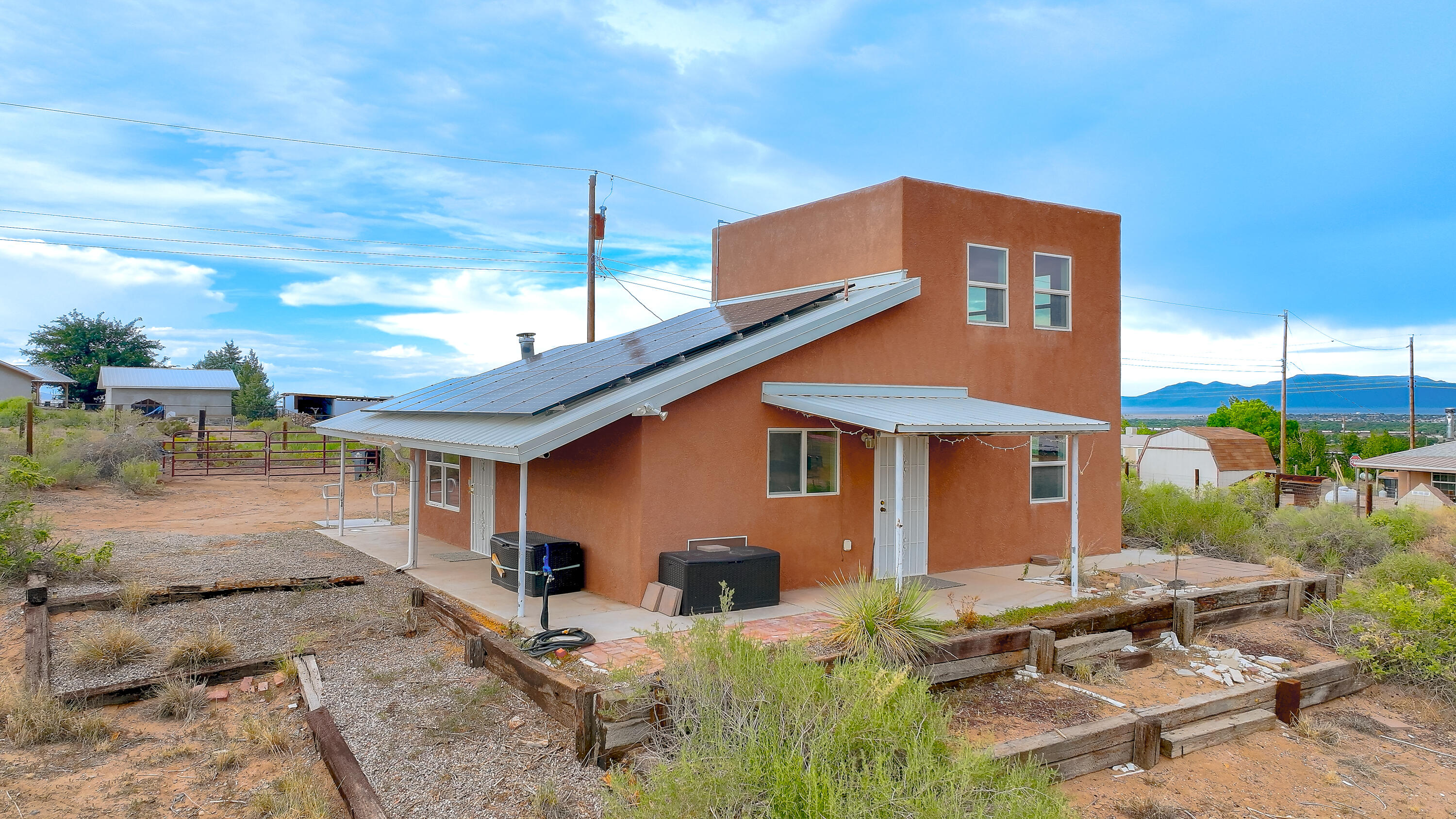 Charming and energy-efficient, this 3-bedroom, 1-bath home sits on a spacious 1-acre lot in a quiet area of Belen. Enjoy comfortable living with a functional layout, bright interior, and fully paid-off solar system for lower utility bills. Metal roof, pellet stove. Plenty of outdoor space for gardening, hobbies, or future expansion. Country feel with easy access to town conveniences -- a perfect mix of space, savings, and simplicity. All electric. There is a water well and Septic for the sewer. No gas needed. Owner/Broker property.
