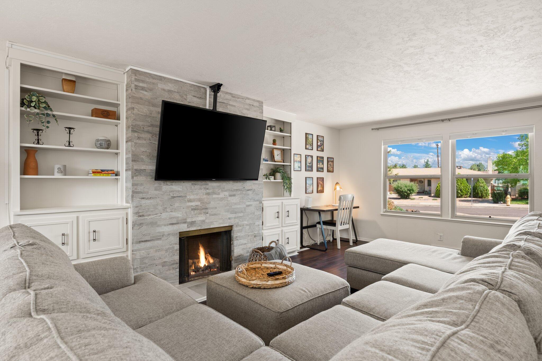 Timeless Mossman Charm in Coveted Stardust Skies! Discover the perfect blend of enduring craftsmanship and modern ease in this classic brick Mossman home. Inside, sun-drenched living spaces and gleaming hardwood floors welcome you. The inviting family room, centered around a cozy fireplace, is the heart of the home. Situated on an expansive lot, this property offers incredible space without the endless upkeep, thanks to thoughtful, water-wise xeriscaping in both the front and backyards. The spacious patio is your canvas for unforgettable outdoor entertaining under the vast New Mexico sky. Located just moments from parks, schools, and shopping, this is the smart, beautiful, and easy-living home you've been waiting for!