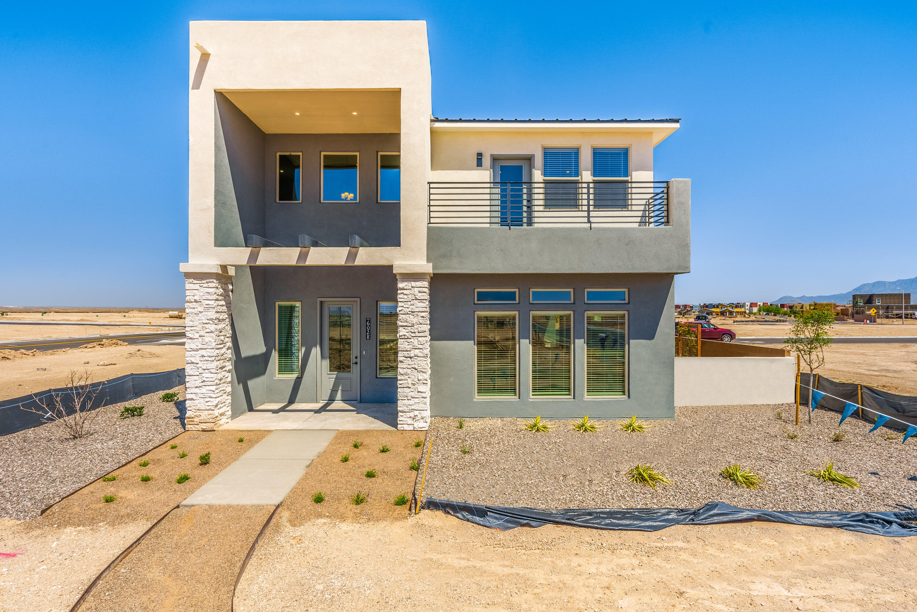 Located in the trend-setting community of Mesa del Sol, this beautiful two-story with one master up and one down is sure to impress and meet your ''dream home'' list.10' ceilings. Large covered patio (11'x 17'). This home was thoughtfully designed with a master + an additional bdrm on the first floor. The 2nd floor has a second master with a private deck. 2nd floor has 3 additional bedrooms, 2nd living area, laundry room and a walk-in linen closet. The kitchen is perfect - large island, very large walk-in pantry, LG stainless steel appliance package which includes 36'' electric cooktop, SS vent hood, built-in microwave/oven, dishwasher and side-by-side refrigerator. Tile in all bathrooms, kitchen and laundry, granite countertops..2'' blinds, NM Build Green Gold. Taexx pest control system.