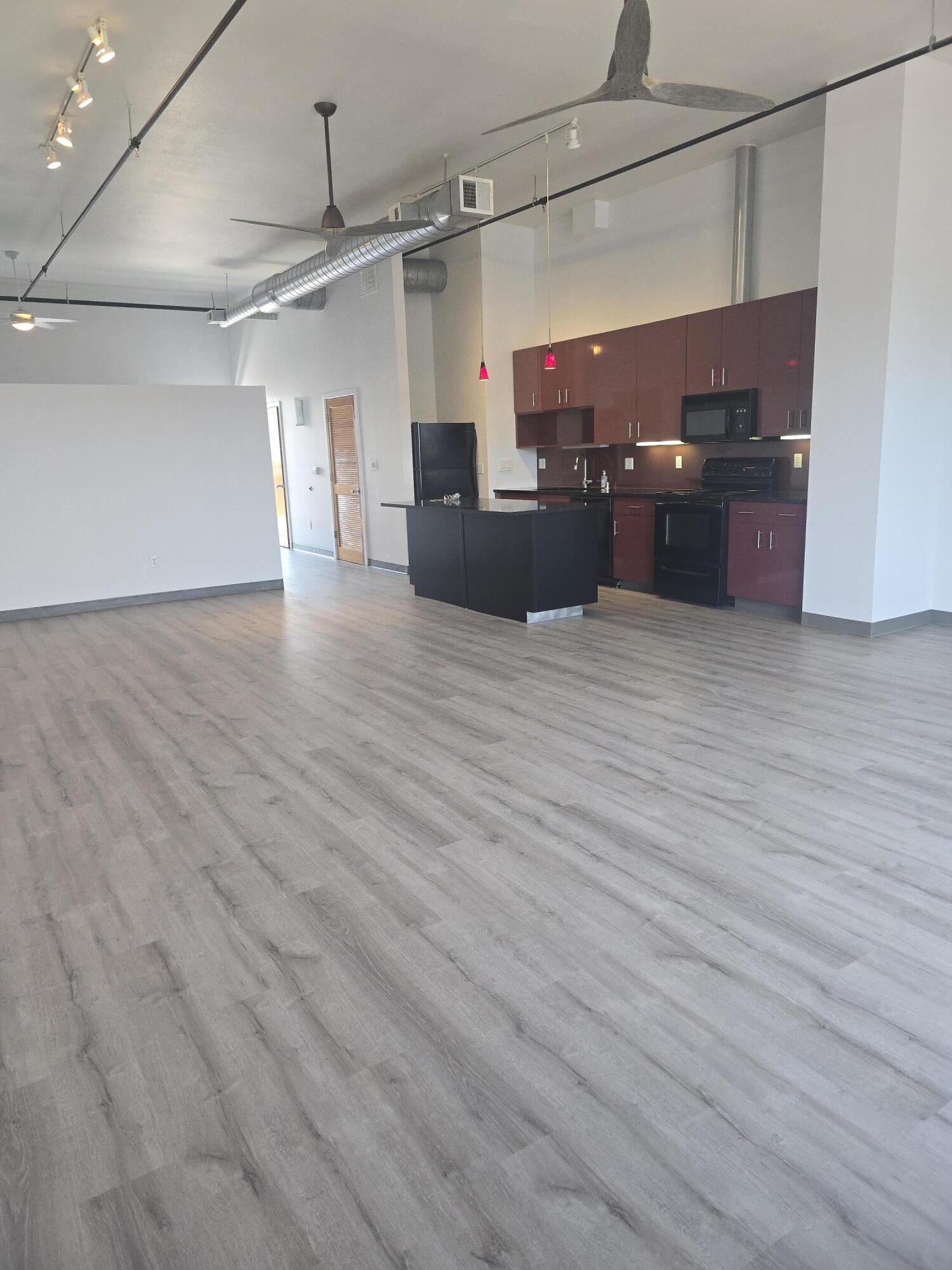 This spacious one-bedroom loft features secure coded access, 14 ft ceilings, French balcony, Italian laminate kitchen cabinets, new ceramic flooring, third floor mountain views, walking distance to restaurants and Rail Runner. Secure parking garage with monthly permit option located across street.