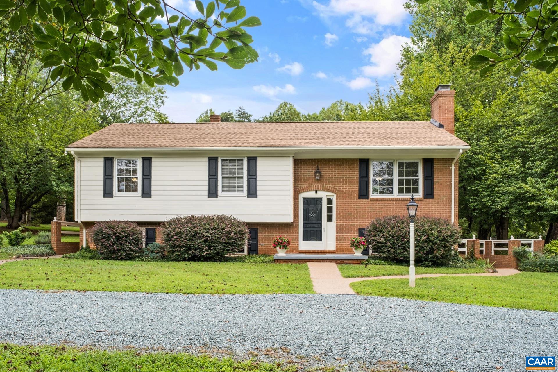 A rare opportunity to live in the heart of beautiful Keswick! This lovingly maintained home sits on nearly four peaceful acres. You will appreciate the gleaming hardwood floors throughout the living area and three spacious bedrooms. The family room on the lower level provides extra space to entertain or just enjoy the large brick fireplace on cozy evenings. The yard is expansive and includes a lovely screened porch, side patio and plenty of open and wooded yard space to explore. Literally steps from Southwest Mountains Vineyards and Montanova Stables, and a short drive from Castle Hill Cider and Merrie Mill, you will never get tired of this location and the views. Don't miss out on this solidly built home ready for your finishing touches to make it just right!