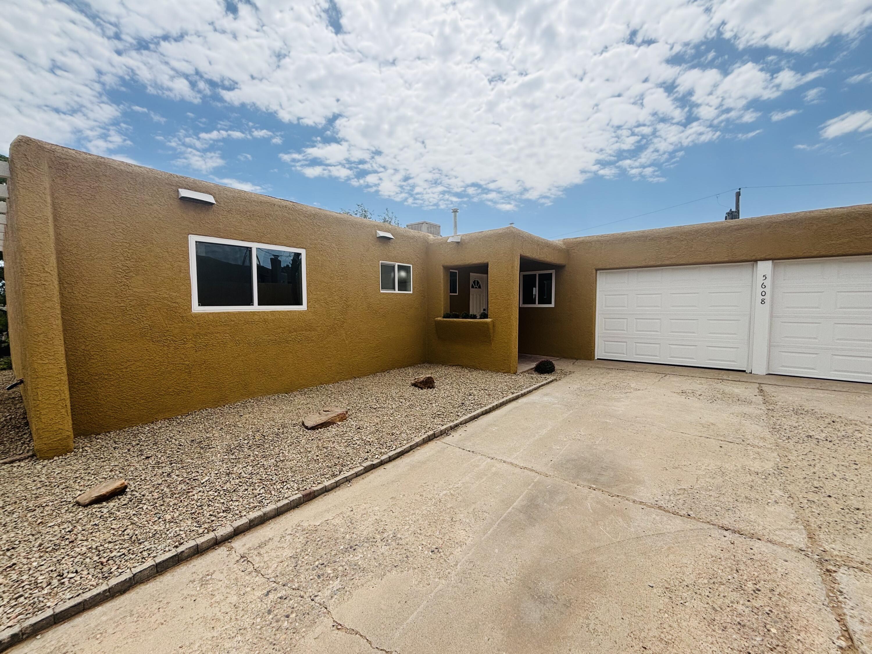 Cute little 3 bedroom, 2 bath 2 car garage home with new windows, new flooring, new cabinets with solid surface granite countertops in your open eat in kitchen.  with new vinyl flooring, custom tile and carpet in the bedrooms. fresh paint custom lighting, new doors, hardware and new exterior doors and garage doors. This home is centrally located and ready to move in