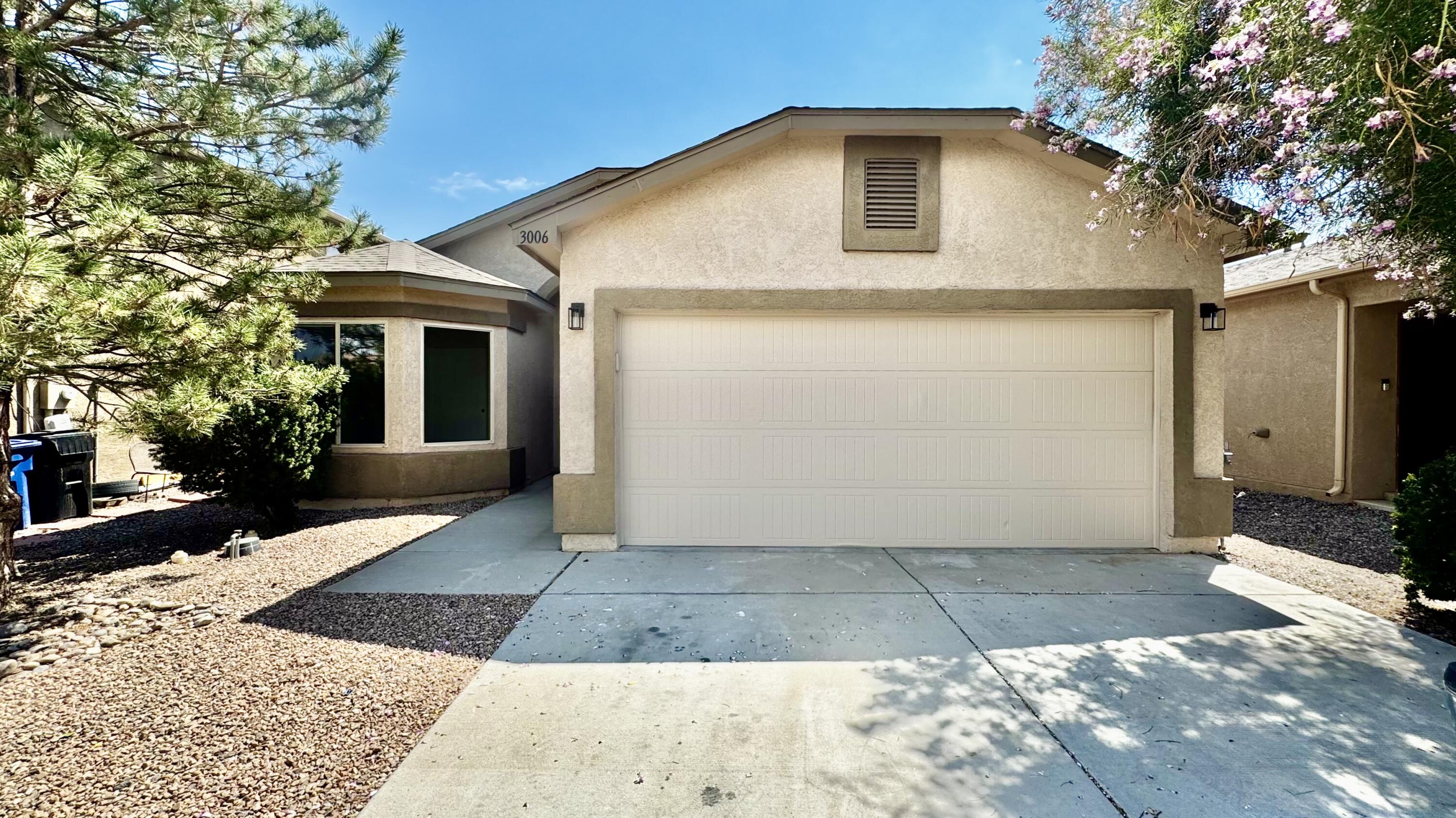 Welcome to this modern, beautifully updated 3 bedroom, 2 bathroom home. Step inside to find a light and bright open layout with high ceilings, all-new LVT flooring, all new plush carpet in the bedrooms, and brand new lighting and interior paint throughout. This home features a sleek kitchen with new stainless steel appliances, new quartz countertops, and new modern faucets and fixtures.Both bathrooms shine with new toilets, new faucets, hardware and finishes. Additional upgrades include new door hardware, five new windows, a new sliding glass door, and a new front door. The attached garage has a new epoxy floor coating and a new garage door opener. Enjoy low-maintenance living with a freshly xeriscaped front and backyard.