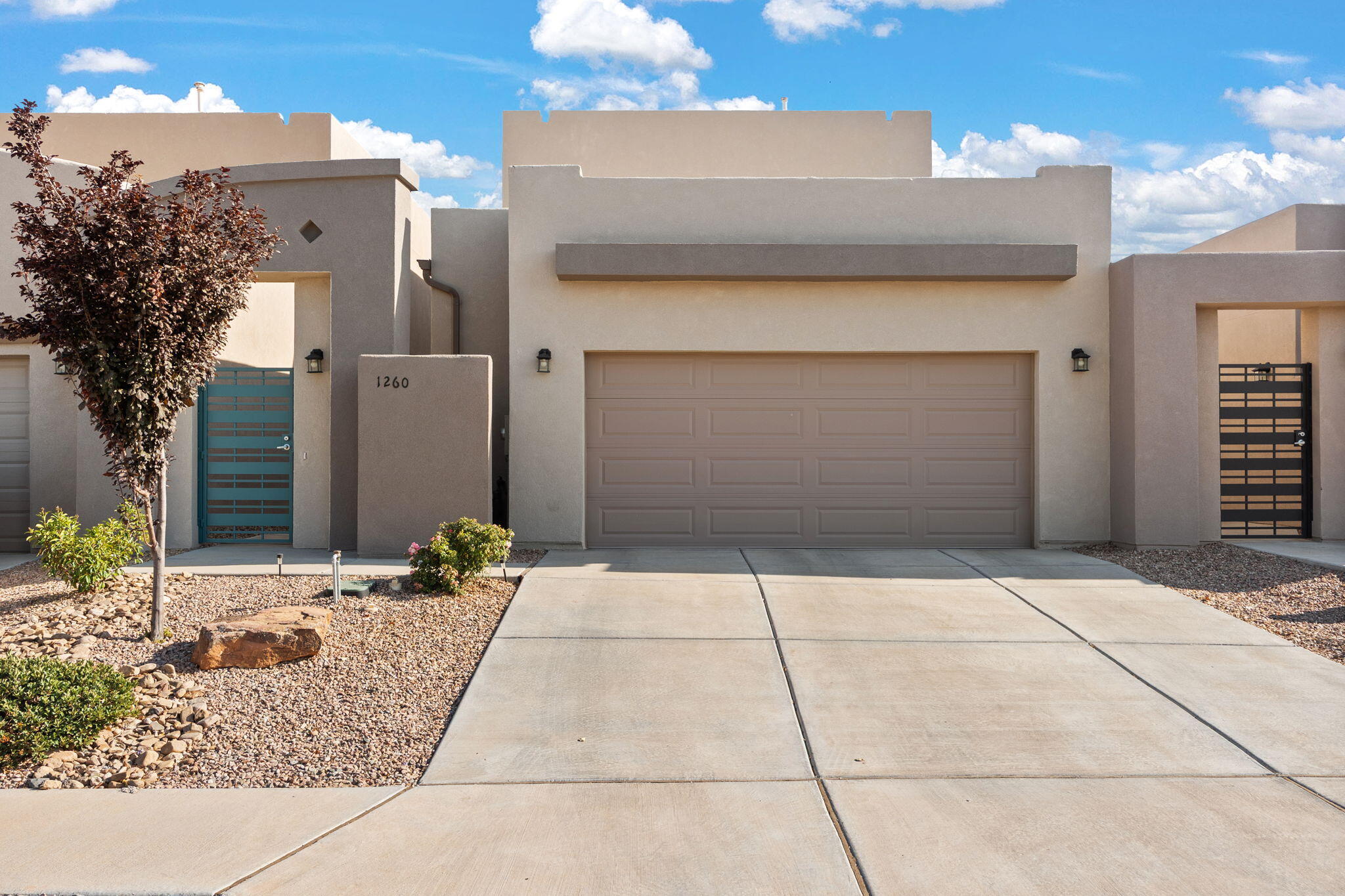Welcome to this stylish Sivage home where modern design meets everyday comfort. Step inside to an open main floor that flows seamlessly into the gourmet kitchen, featuring a large island perfect for gathering. With 4 bedrooms and 3 baths, there's room for everyone. Large primary suite with double sinks and spacious shower.  Large laundry room and 2 car garage.  Outdoors, enjoy low-maintenance living with artificial turf (warranty approx. 12 years), custom gutters (warranty approx. 17 years), a covered patio, and solar sail--ideal for relaxing or entertaining. No direct neighbors behind means added privacy, plus biking/walking trails and open lawn just steps away. Three parks nearby, including one within 50 yards, complete this exceptional setting.