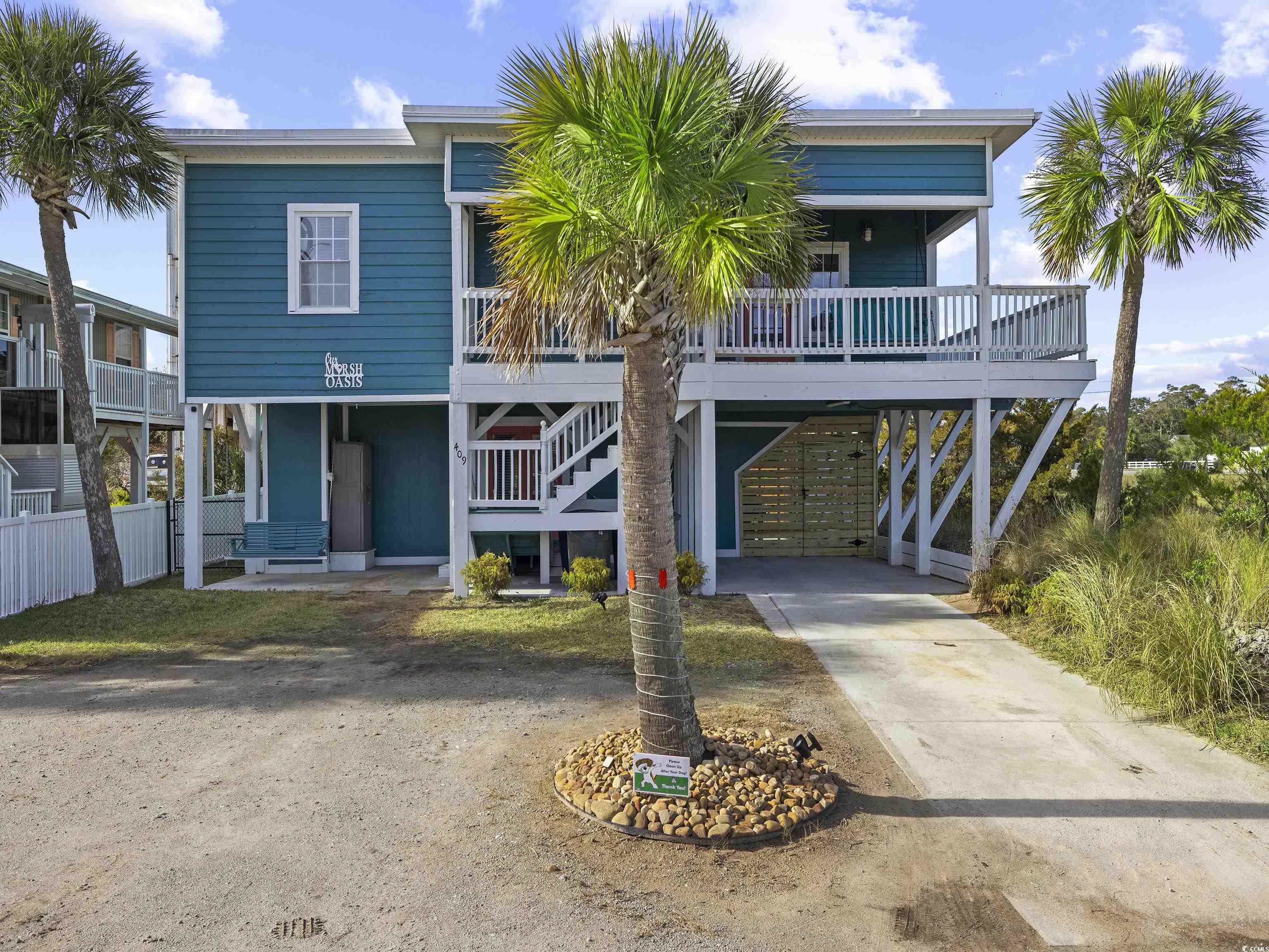 Welcome to your dream coastal retreat in the heart of Cherry Grove Beach, just a short stroll from the sand and the vibrant energy of Sea Mountain Highway. This stunning 4-bedroom, 2-bathroom raised beach home has been thoughtfully remodeled to blend modern comfort with timeless coastal charm. Highlights Include: Bonus Flex Room currently set up as a bedroom deal for guests or short-term rental income. Luxury vinyl plank flooring throughout for a sleek, low-maintenance finish Spacious kitchen with ample cabinetry, generous counter space, and modern finishes Gorgeous new tile walk-in showers in both bathrooms for a spa-like experience. Open floor plan that enhances natural light and coastal breezes Outdoor Living: Wraparound deck with private views—this is the last home on the street! Spacious backyard with room for a small pool. Expansive covered patio downstairs featuring a hot tub and outdoor shower perfect for entertaining or unwinding after a beach day  Great Investment Potential: With short-term rentals allowed, this home offers excellent income opportunities in one of North Myrtle Beach’s most desirable neighborhoods. Just minutes from local favorites like Snooky’s Oceanfront, Boulineau’s Foods Plus, and Murphys, this Cherry Grove gem won’t last long.   Schedule your showing today and make this beachside beauty yours