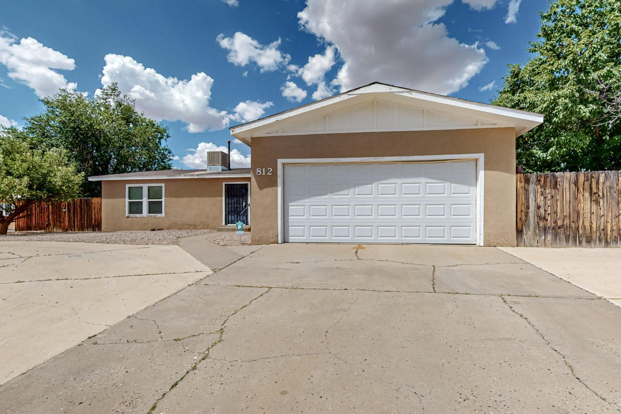 Great single story  home on a corner lot offering 3 bedrooms ,2 full bath 2car garage plus an additional 1car garage/studio in the back with electricity! Double entry doors for security, Two living areas and one offers a nice wood Burning fireplace. Laminate flooring throughout living and kitchen areas, carpet in all bedrooms.  Kitchen offers plenty of cabinet and countertop space, plenty of room for your dining table and more than one cook !  Plumbing has been replaced, a new garage door. Master suite is nice and large and offers plenty of furniture, arranging options, double vanity, garden tub, and separate shower. Other two bedrooms are nice size and one offers crawlspace access from the closet.  This is a GREAT home ready for its new owner!