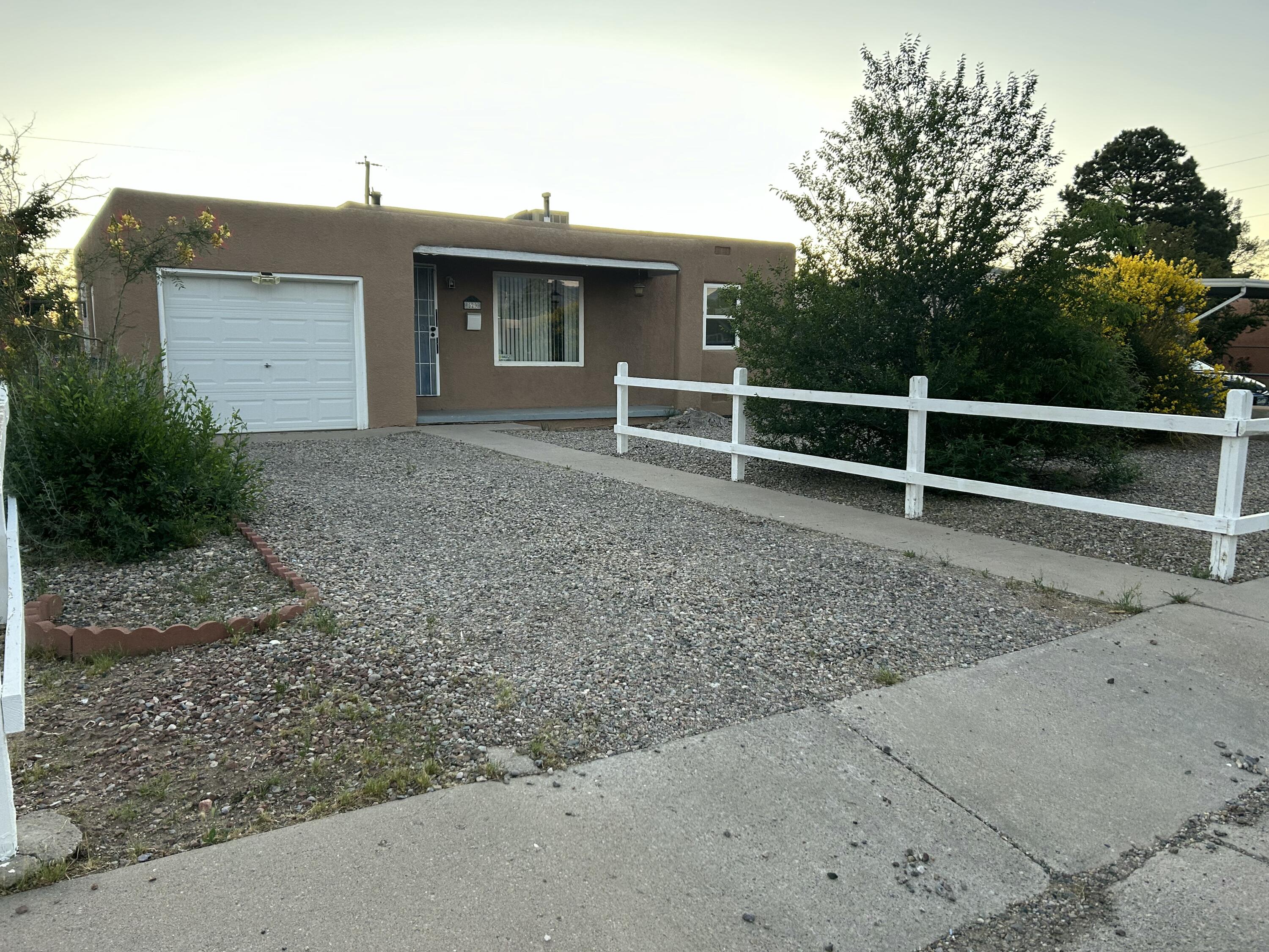 This delightful 2-bed, 1-bath home nestled on a spacious lot in the heart of Albuquerque. With its classic 1950s charm, solid construction, & thoughtful updates, it offers unbeatable value for 1st time buyers, downsizers, or savvy investors. Inside, enjoy a bright, inviting living space with original hardwood floors, fresh paint,& plenty of natural light. The kitchen includes ample cabinet space and a cozy dining nook, while the large backyard is ideal for gardening, entertaining, or future expansion. Conveniently located near Kirtland AFB, Nob Hill, & UNM--and just over a mile from the SE Area Police Substation - the home benefits from improved safety. Albuquerque has seen a double-digit drop in property and violent crimes in 2025, it's a smart time to invest in a the area!