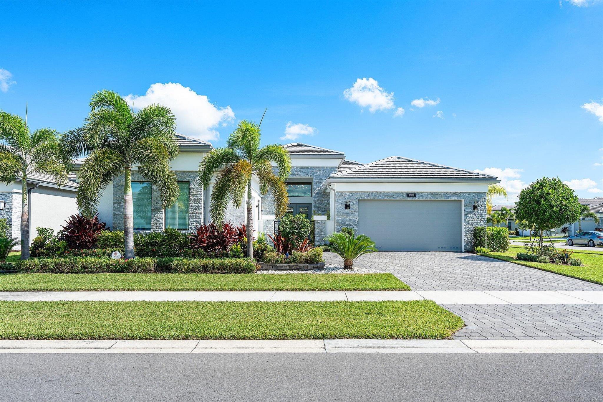 No expense has been spared in this designer perfect Carlyle model. Great curb appeal - lush landscaping w/lighting, stone front and privacy gate. The home (3/3.1+Club Room+3cg) sits on an oversized corner lot & has impact windows, full house generator, two mini split A/C's in garages, 24'' porcelain tile floors, designer window treatments & light fixtures, hi-hats, fans, designer wall treatments, built-ins, custom closets, upgraded baths + more! Gourmet kitchen w/gas, white cabinets, quartz counters, counter depth snack bar, stainless hood, Viking d/w & range, wine fridge, center island with marble counter & more! Luxury master suite. You'll love the ''backyard resort'' with marble deck, summer kitchen, birdcage w/picture frame screen, open pool, cabana bath, grassy areas & view of lake This home is located in Valencia Grand, a premier 55+ lifestyle community featuring a spectacular 44,000 square-foot clubhouse and almost 9-acre recreational facility. Endless activities and opportunities for fun abound - there are activities, trips, shows, and clubs of all types. The clubhouse features an elegant foyer and lobby, Grand ballroom with raised stage and dance floor, three spacious card rooms, Sports Lounge with billiard tables, poker tables and golf simulator, Restaurant with bar and indoor and outdoor seating, Poolside Bar &amp; Happy Hours at the Poolside Bar, Arts and crafts center, Catering kitchen and cooking studio, Exercise studio with ping pong, Fully equipped fitness center and men's and women's locker rooms with steam rooms and showers, outdoor yoga garden, Mind and Body Spa for everything from hair to nails to facials to massages and more! There are four pools - a beautiful Resort-style pool and Shade Pavilions, Lap pool, Resistance walking pool, Grandchildren's wading pool, and an Outdoor whirlpool spa. There are six har-tru tennis courts with shade pavilions and lighting for night play, tennis pro shop and shaded tennis and pickleball seating areas, tennis pro, league play, four indoor pickleball courts, seven outdoor pickleball courts, pickleball pro, league play, 4 bocce courts and walking/jogging/biking paths just outside the community. Valencia Grand is conveniently located near shopping, restaurants, houses of worship and major highways!